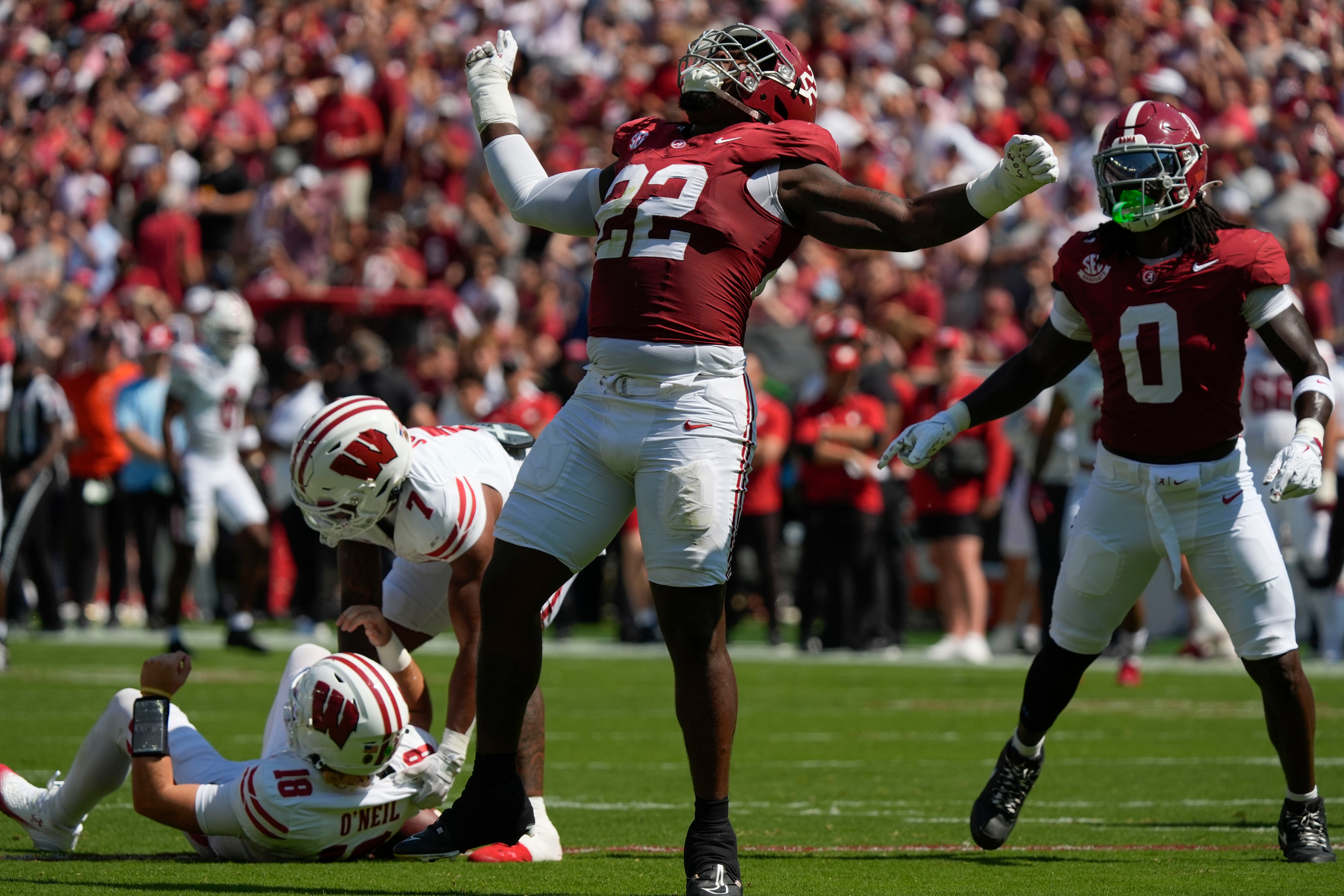 Sep 13, 2025; Tuscaloosa, Alabama, USA; Alabama defensive lineman LT Overton (22) celebrates after sacking Wisconsin quarterback Danny O'Neil (18) at Saban Field at Bryant-Denny Stadium.