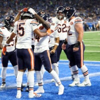 Sep 14, 2025; Detroit, Michigan, USA; Chicago Bears wide receiver Rome Odunze (15) celebrates with teammates after a touchdown against the Detroit Lions during the first quarter at Ford Field.