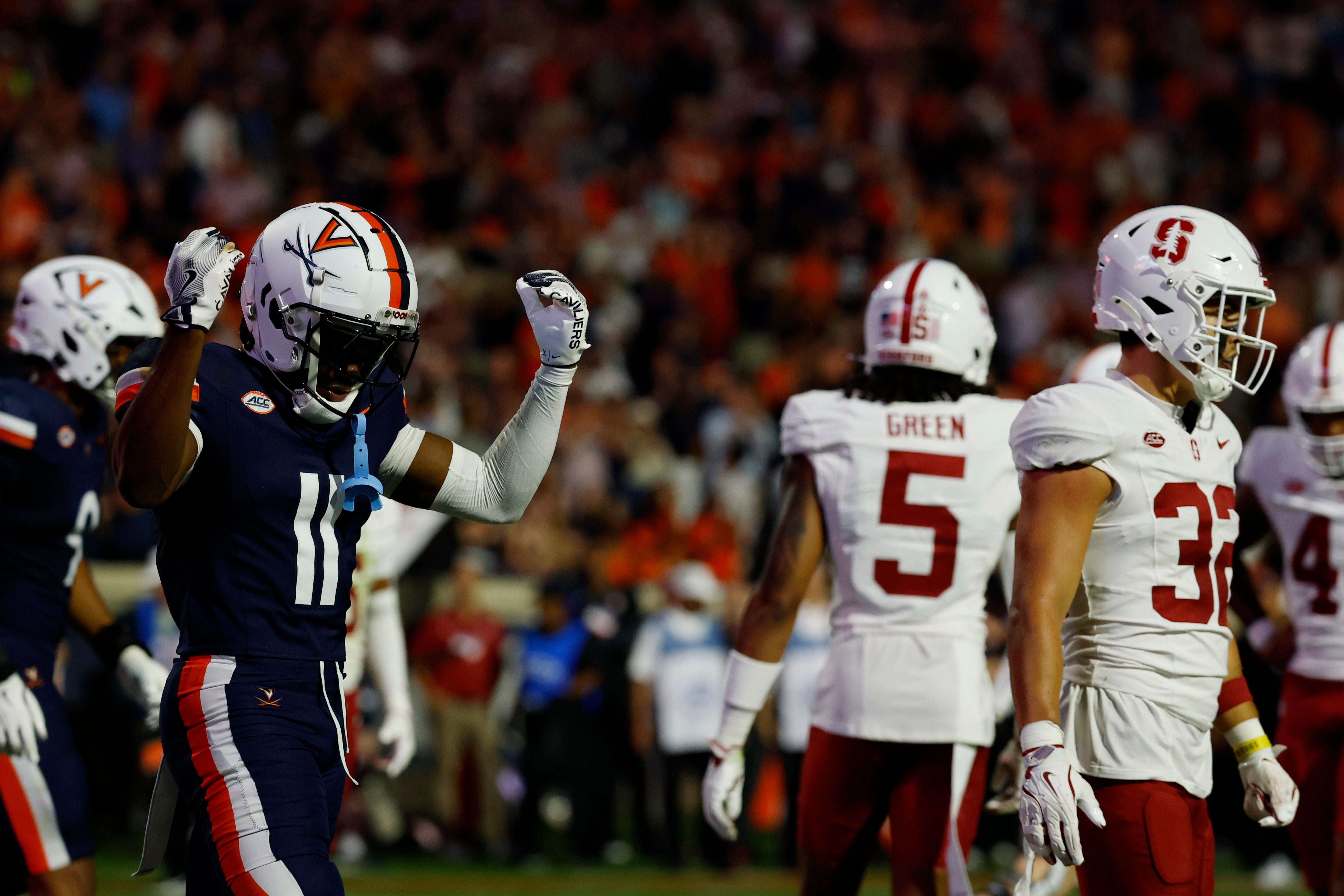 Sep 20, 2025; Charlottesville, Virginia, USA; Virginia Cavaliers wide receiver Trell Harris (11) celebrates after catching a touchdown pass against the Stanford Cardinal during the first quarter at Scott Stadium.