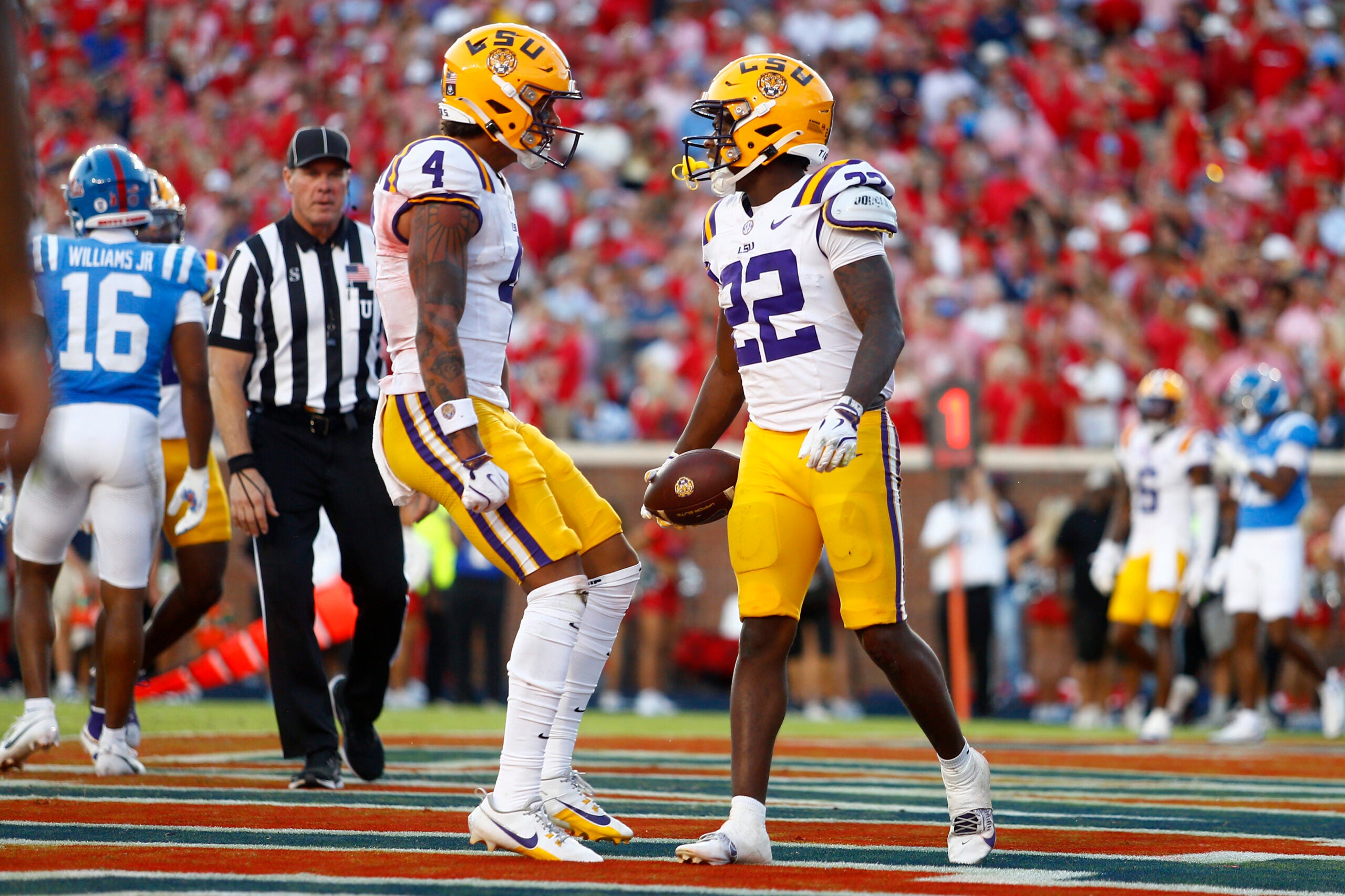 Sep 27, 2025; Oxford, Mississippi, USA; LSU Tigers wide receiver Nic Anderson (4) and running back Harlem Berry (22) react after a touchdown run during the fourth quarter against the Mississippi Rebels at Vaught-Hemingway Stadium. Mandatory Credit: Petre Thomas-Imagn Images