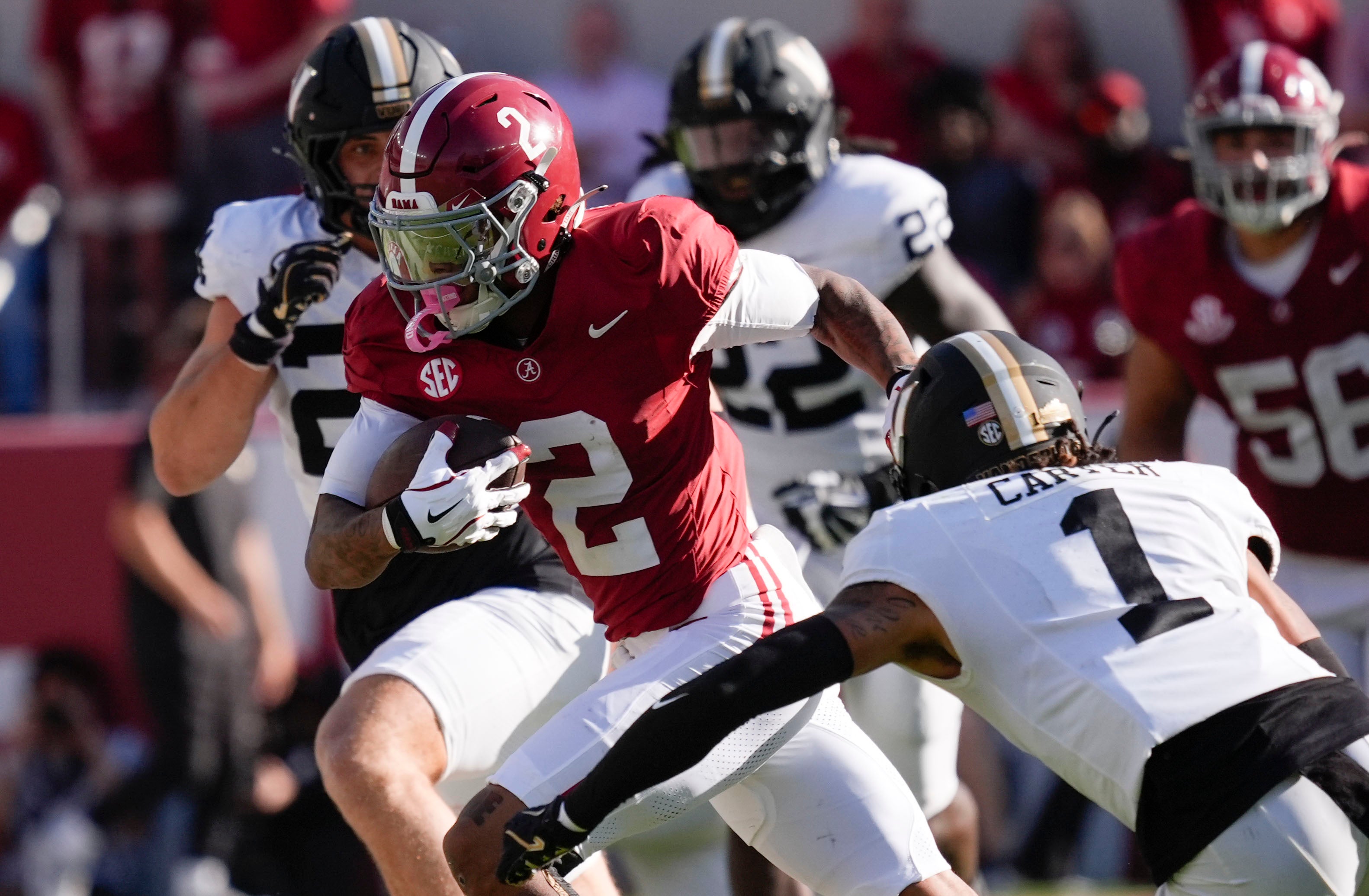 Oct 4, 2025; Tuscaloosa, Alabama, USA; Alabama wide receiver Ryan Williams (2) makes a catch and run for a first down with Vanderbilt defensive back Dontae Carter (1) closing at Saban Field at Bryant-Denny Stadium.