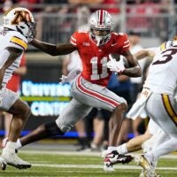 Ohio State Buckeyes wide receiver Quincy Porter (11) runs past Minnesota Golden Gophers linebacker Devon Williams (9) during the NCAA football game at Ohio Stadium in Columbus on Oct. 4, 2025. Ohio State won 42-3.