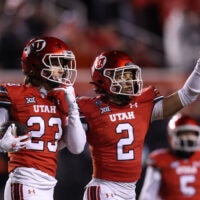 Oct 11, 2025; Salt Lake City, Utah, USA; Utah Utes safety Jackson Bennee (23) and cornerback Smith Snowden (2) react to a play against the Arizona State Sun Devils during the third quarter at Rice-Eccles Stadium.