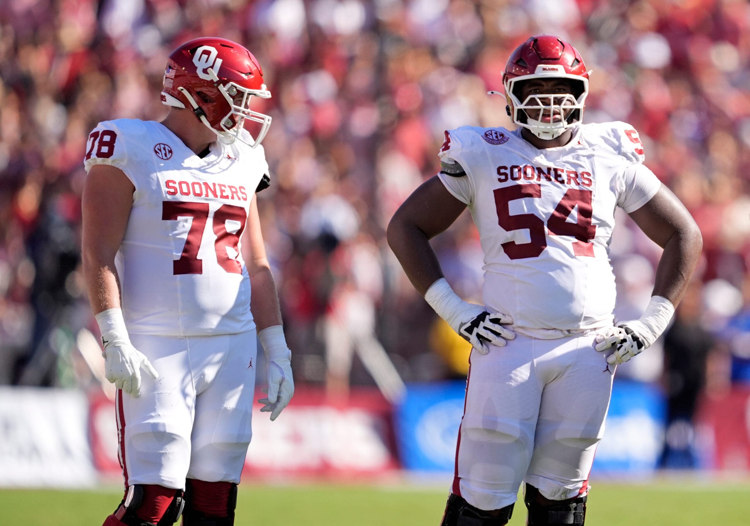 Oklahoma Sooners offensive lineman Luke Baklenko (78) and Oklahoma Sooners offensive lineman Febechi Nwaiwu (54) wait to line up in the first half of the Red River Rivalry college football game between the University of Oklahoma Sooners and the Texas Longhorn at the Cotton Bowl Stadium in Dallas, Texas, Saturday, Oct. 11, 2025.