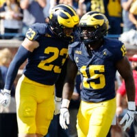 Oct 18, 2025; Ann Arbor, Michigan, USA; Michigan Wolverines linebacker Cole Sullivan (23) and linebacker Ernest Hausmann (15) celebrates in the first half against the Washington Huskies at Michigan Stadium.