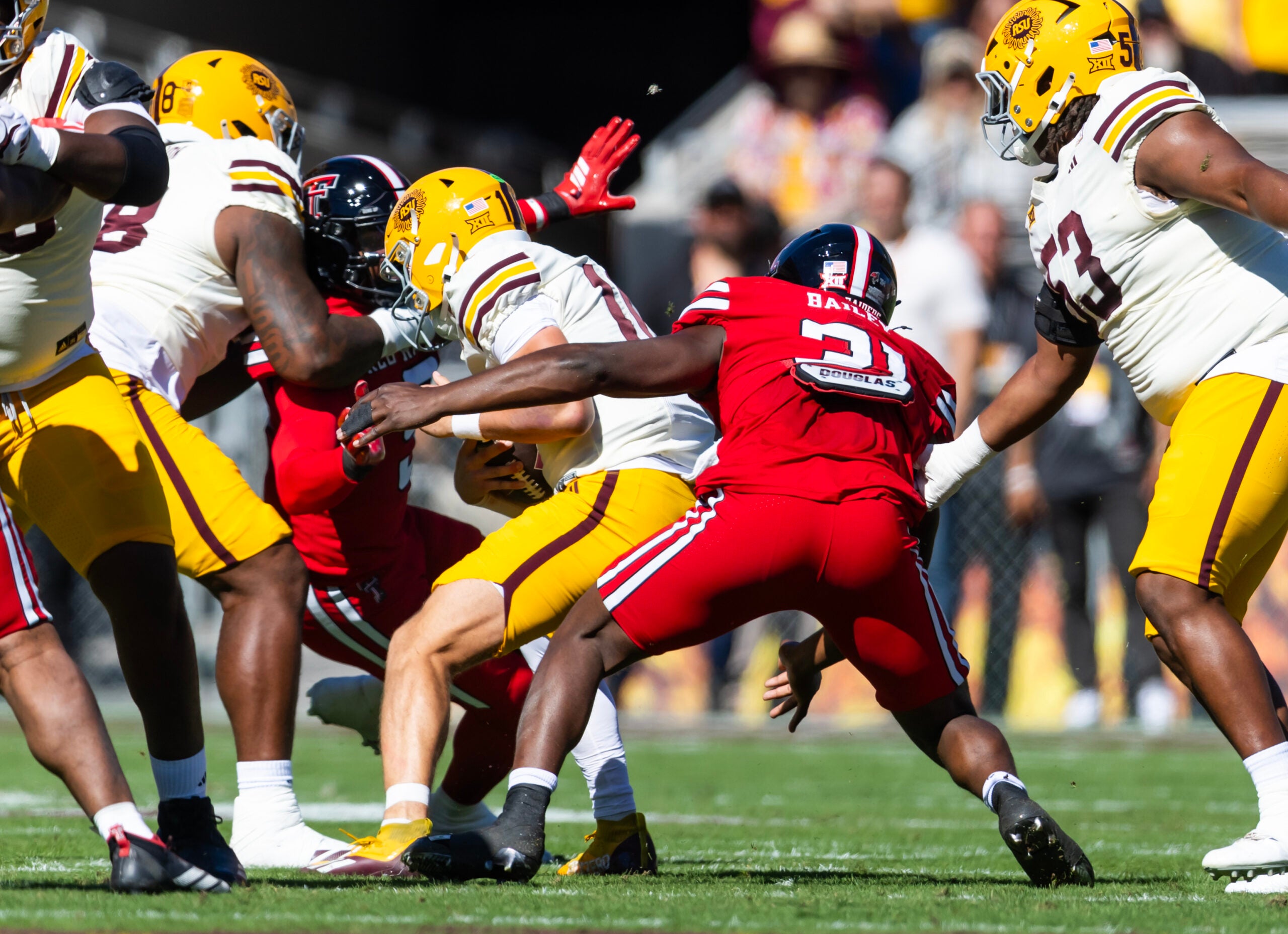 Oct 18, 2025; Tempe, Arizona, USA; Texas Tech Red Raiders linebacker David Bailey (31) sacks Arizona State Sun Devils quarterback Sam Leavitt (10) in the first half at Mountain America Stadium.