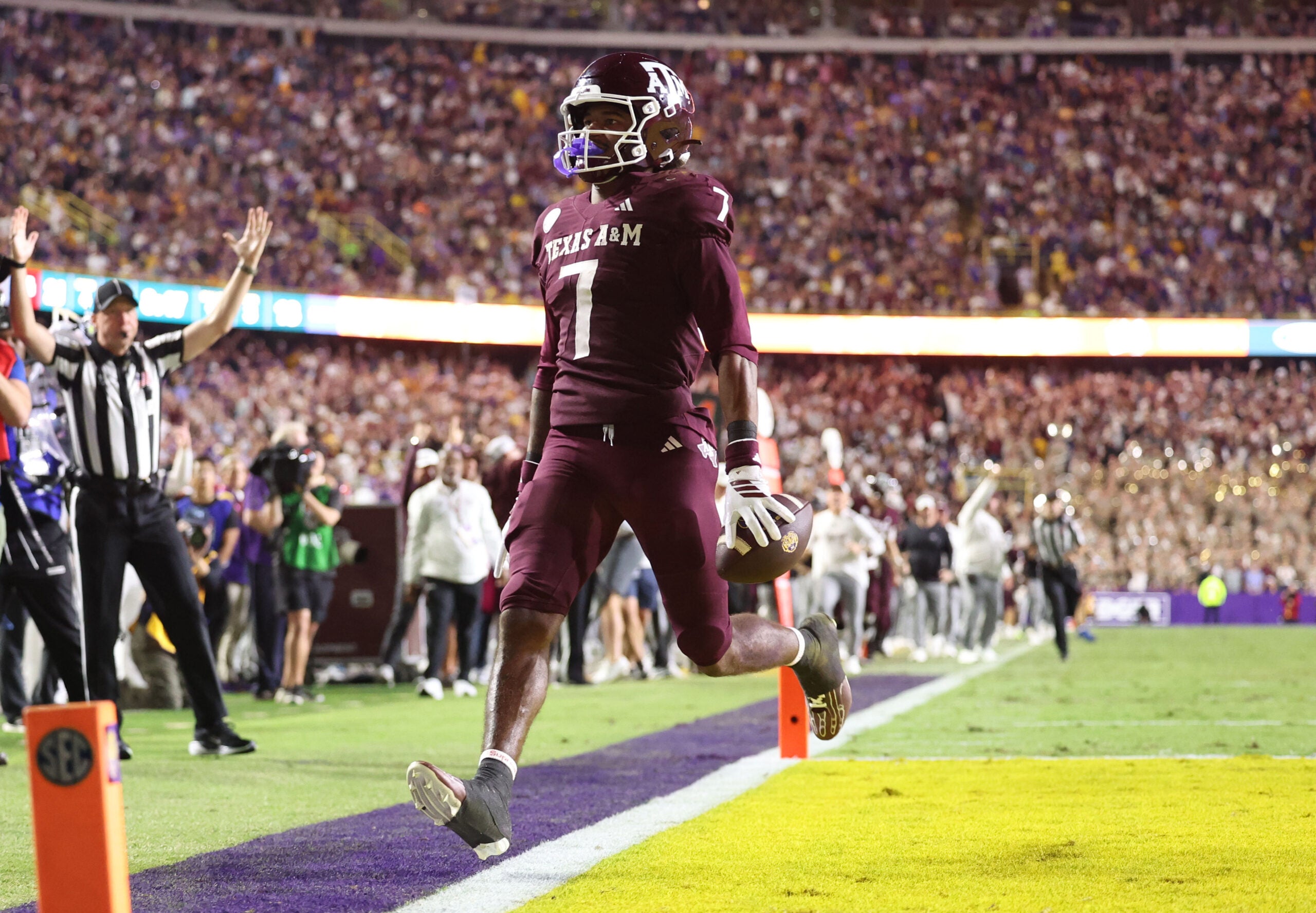 Oct 25, 2025; Baton Rouge, Louisiana, USA; Texas A&M Aggies wide receiver KC Concepcion (7) returns a punt for a touchdown during the second half against the Louisiana State Tigers at Tiger Stadium.