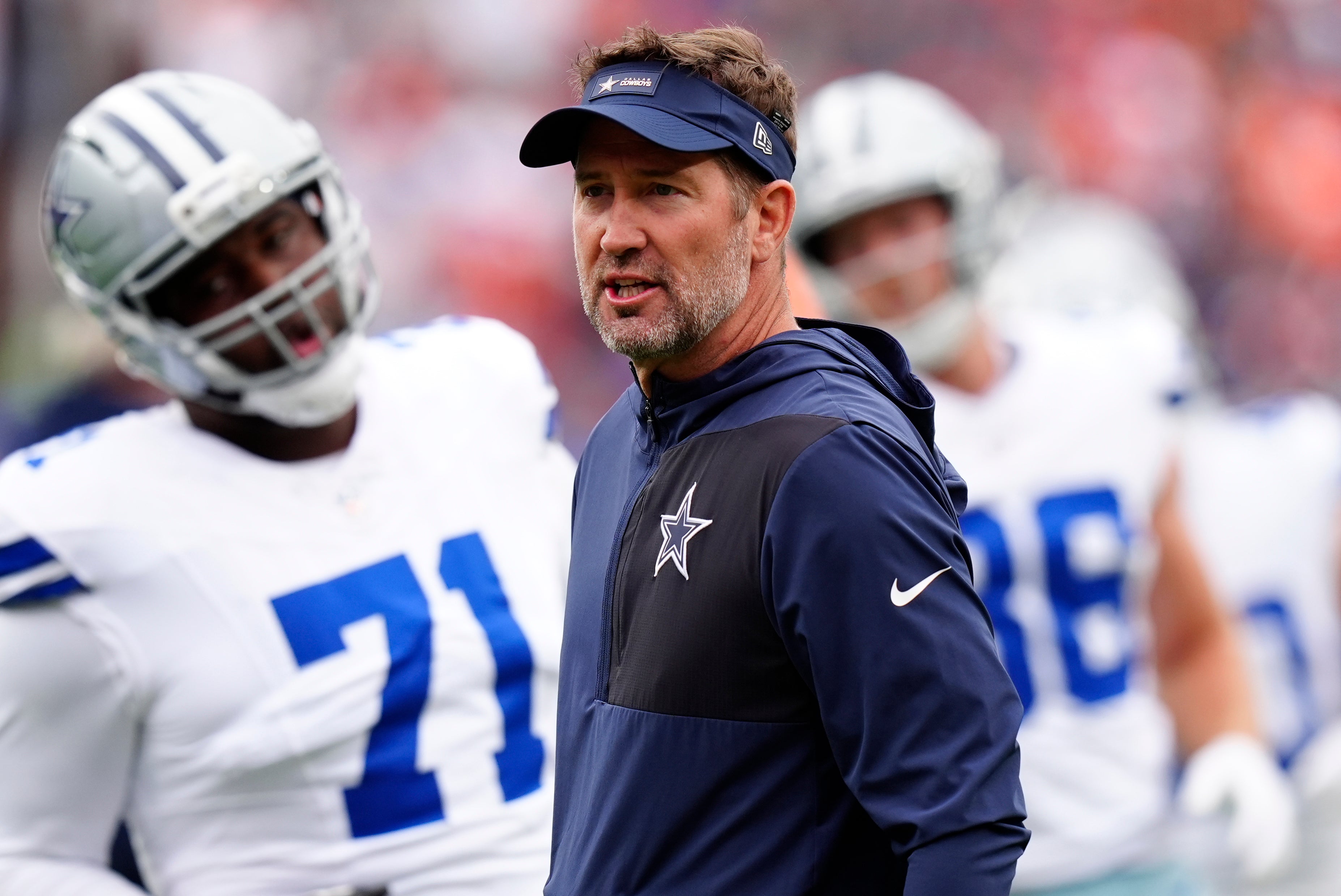 Oct 26, 2025; Denver, Colorado, USA; Dallas Cowboys head coach Brian Schottenheimer looks on before the game against the Denver Broncos at Empower Field at Mile High.