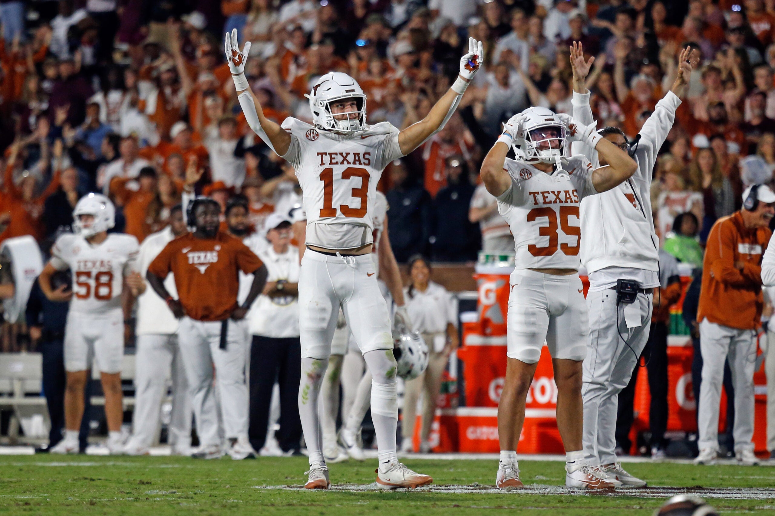 Oct 25, 2025; Starkville, Mississippi, USA; Texas Longhorns wide receiver Parker Livingstone (13) and Texas Longhorns wide receiver Rett Andersen (35) react during overtime against the Mississippi State Bulldogs at Davis Wade Stadium at Scott Field.