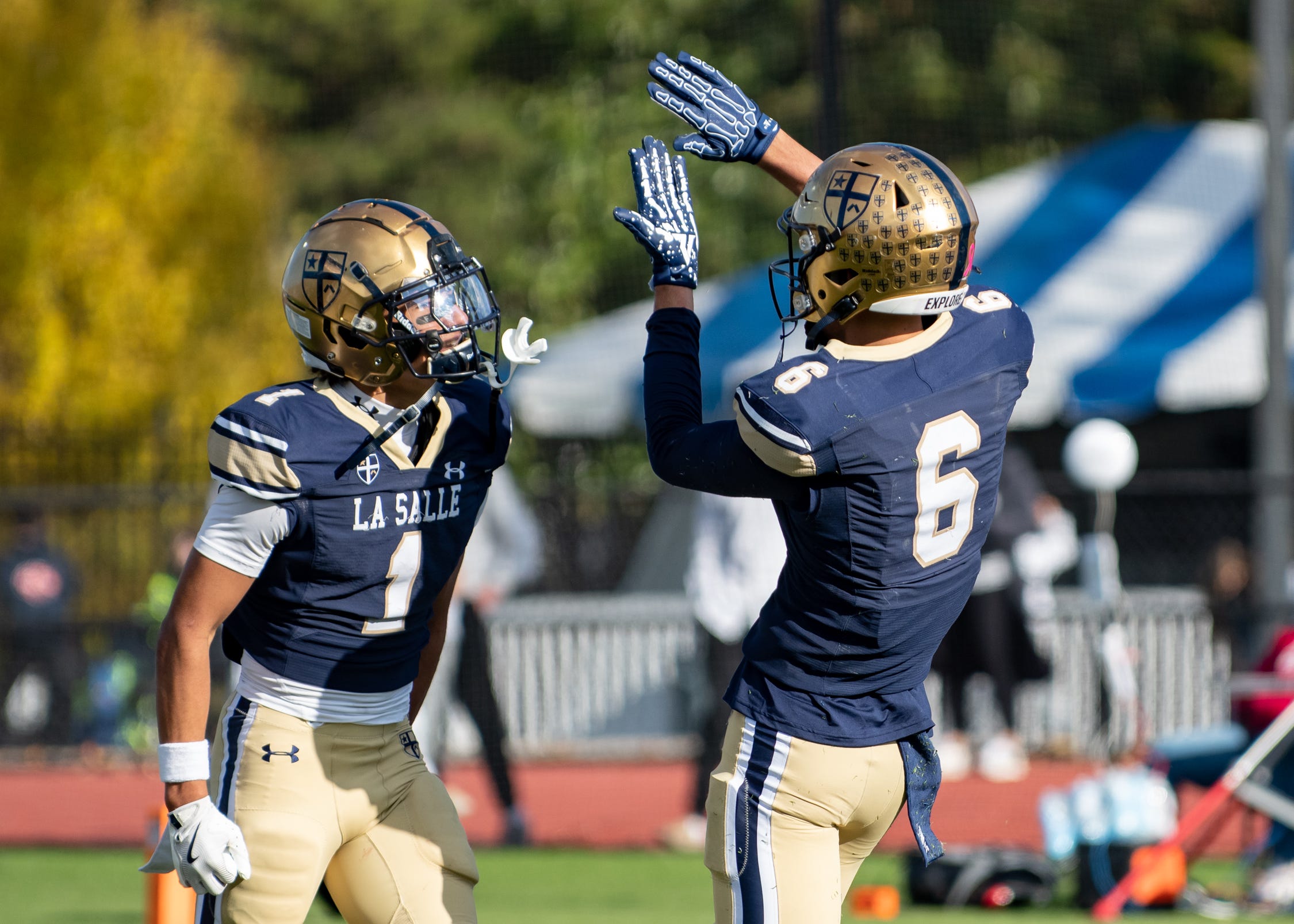 La Salle wide receivers Owen Johnson, left, and Joey O'Brien celebrate an interception against St. Joseph's Prep in a Philadelphia Catholic League championship football game, Saturday, Nov. 1, 2025, at Villanova Stadium in Radnor. The Explorers defeated the Hawks 24-14 for the title.