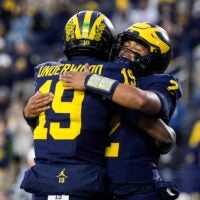 Michigan quarterback Bryce Underwood (19) hugs quarterback Jadyn Davis (2) during warm up ahead of the Purdue game at Michigan Stadium in Ann Arbor on Saturday, November 1, 2025.