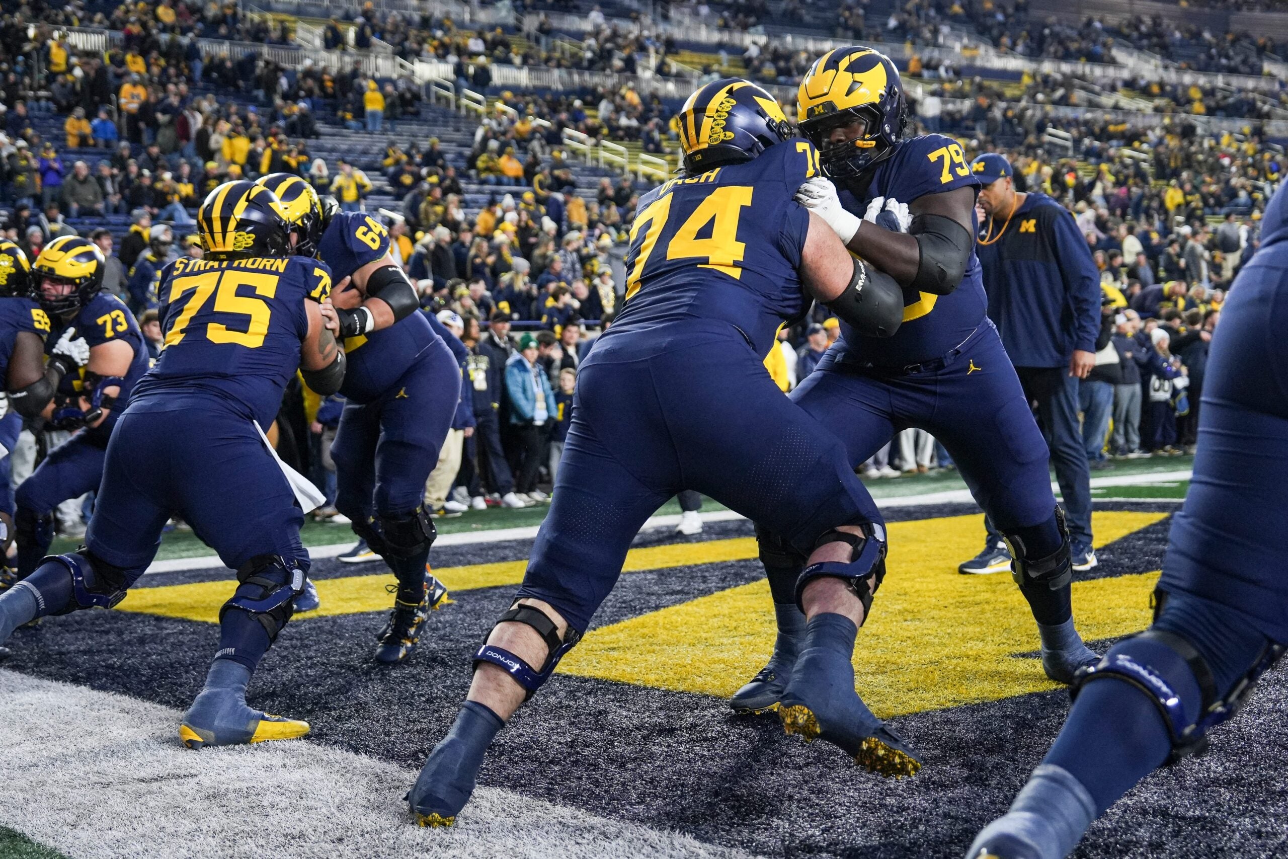 Michigan offensive lineman Ty Haywood (79) warms up with offensive lineman Avery Gach (74) ahead of the Purdue game at Michigan Stadium in Ann Arbor on Saturday, November 1, 2025.