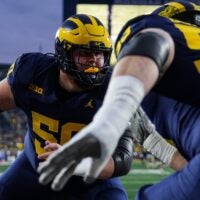 Michigan offensive lineman Luke Hamilton (50) warms up with offensive lineman Jake Guarnera (53) ahead of the Purdue game at Michigan Stadium in Ann Arbor on Saturday, November 1, 2025.