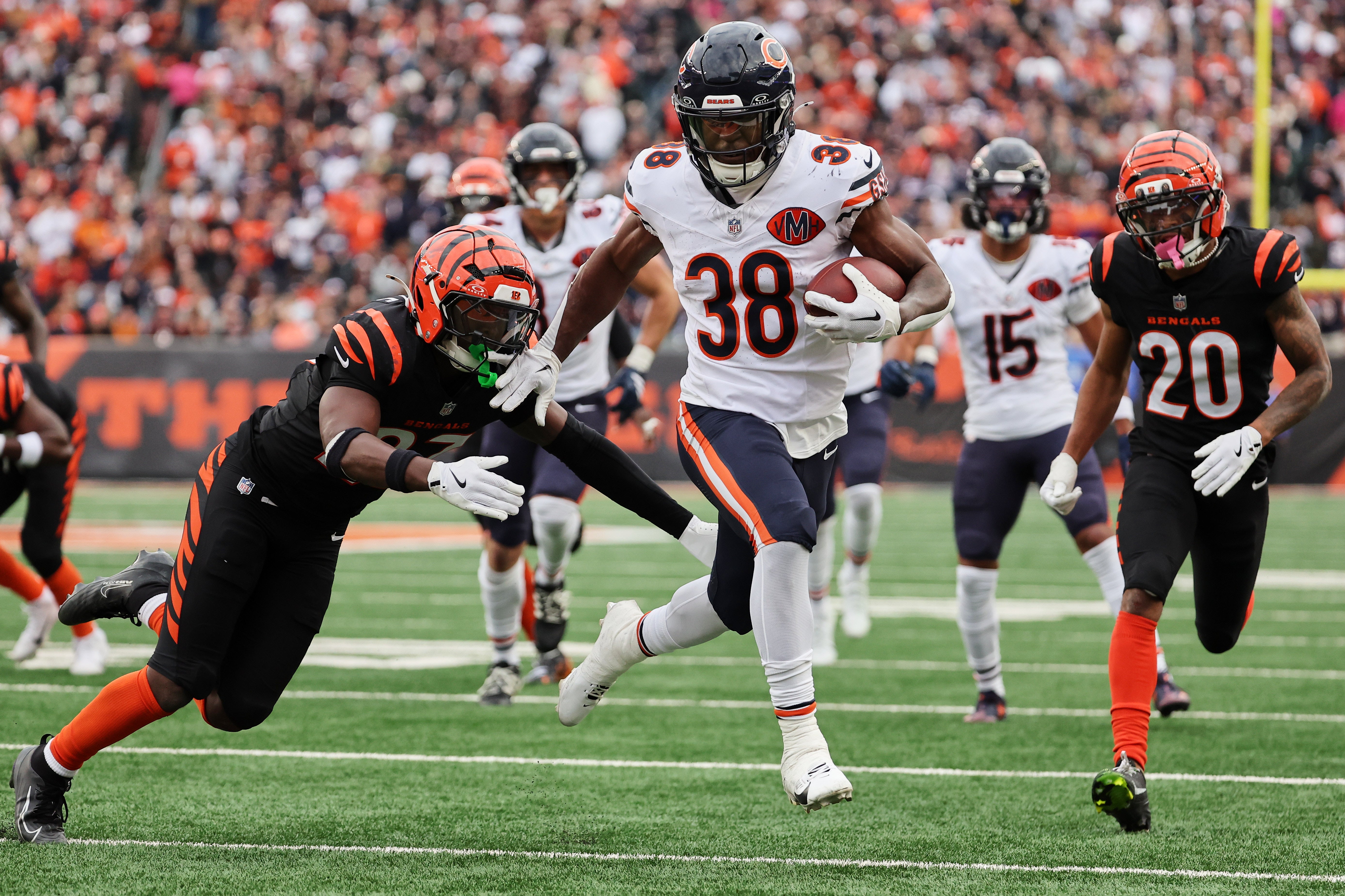 Nov 2, 2025; Cincinnati, Ohio, USA; Chicago Bears running back Brittain Brown (38) runs for a touchdown against Cincinnati Bengals safety Jordan Battle (27) and cornerback DJ Turner II (20) during the third quarter at Paycor Stadium.