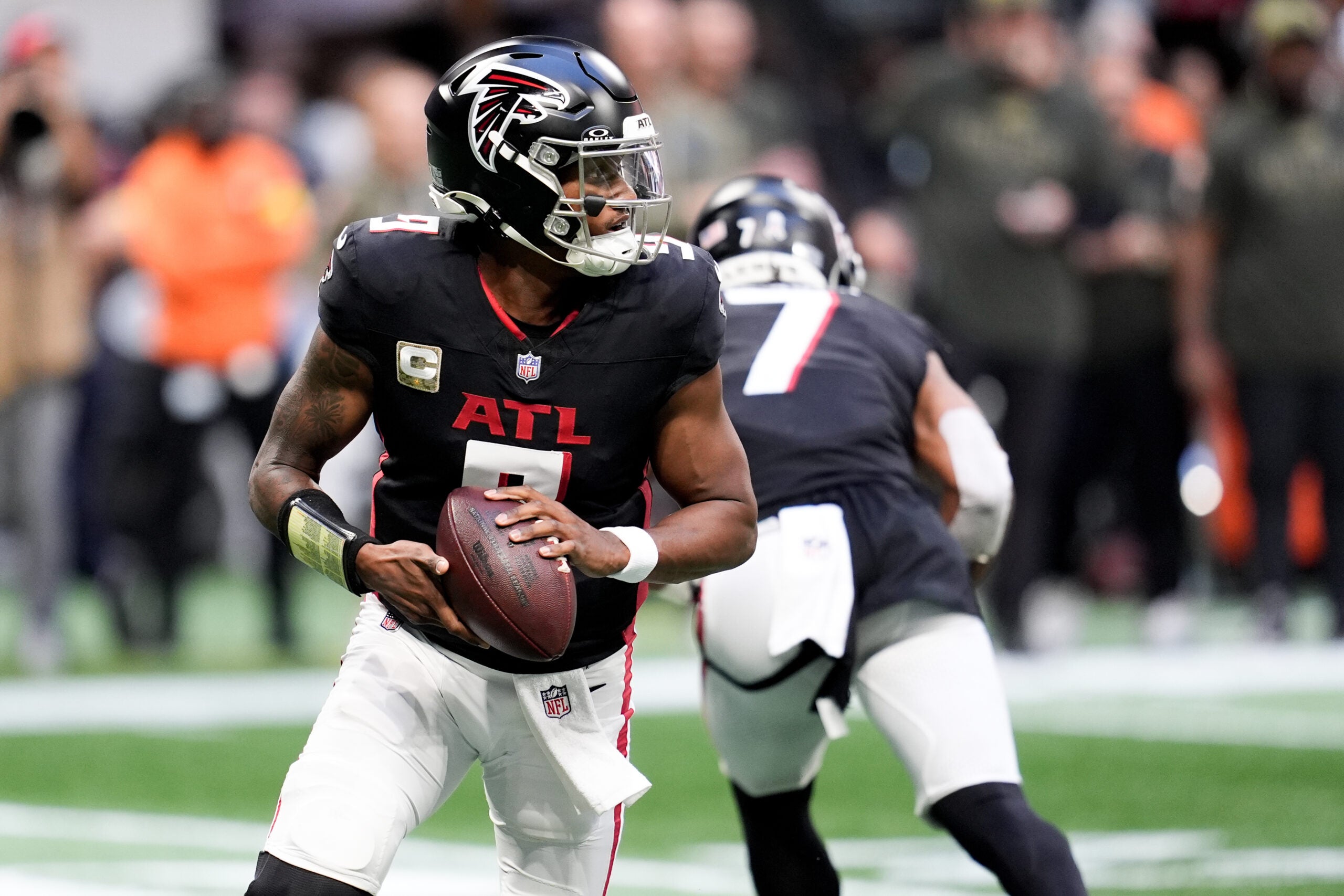 Nov 16, 2025; Atlanta, Georgia, USA; Atlanta Falcons quarterback Michael Penix Jr. (9) looks for an open receiver in the second half against the Carolina Panthers at Mercedes-Benz Stadium.