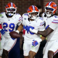 Nov 15, 2025; Oxford, Mississippi, USA; Florida Gators linebacker Jaden Robinson (29), linebacker Jayden Woods (15) and linebacker Kamran James (24) react after an interception during the first quarter against the Mississippi Rebels at Vaught-Hemingway Stadium.