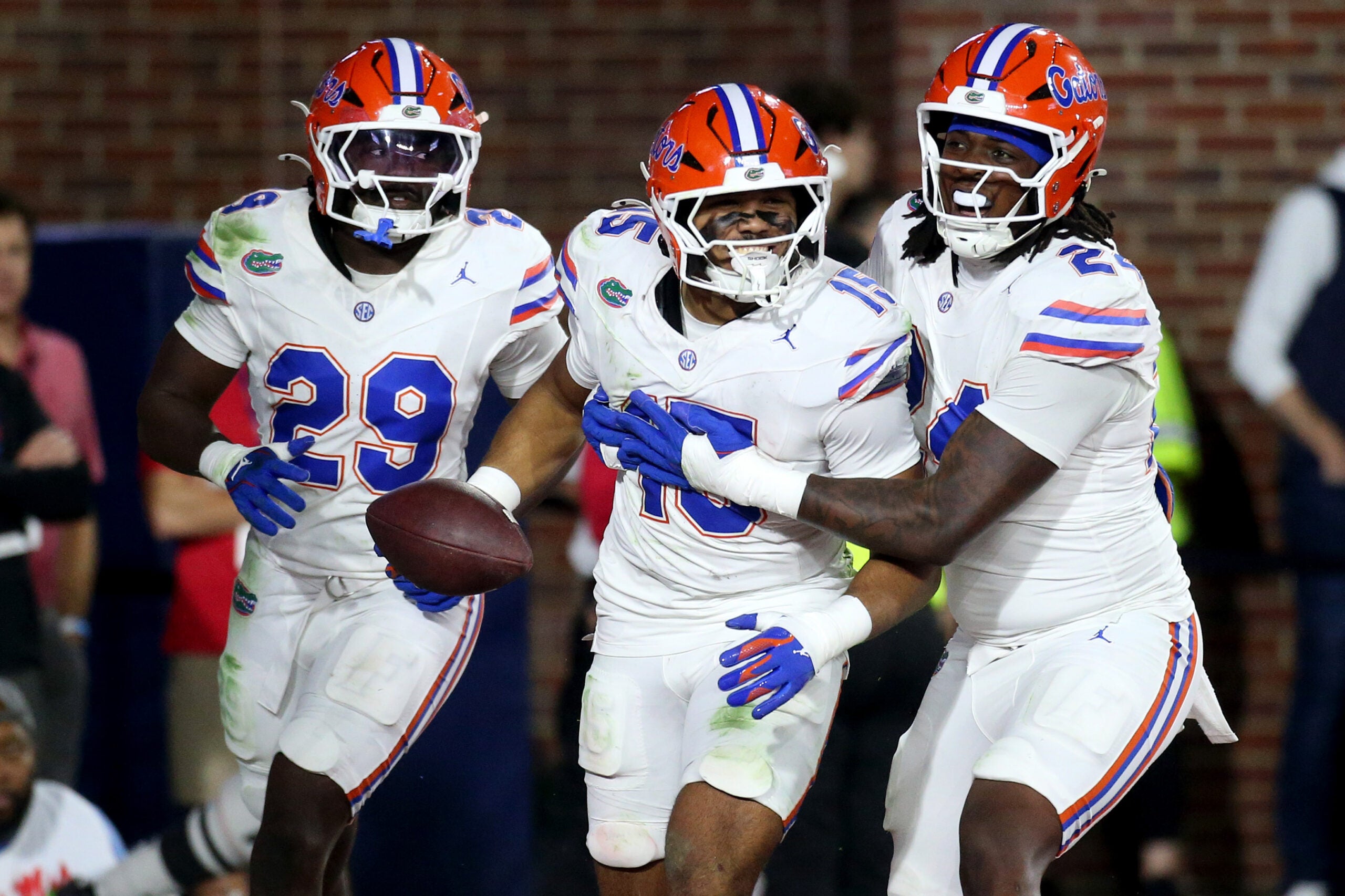 Nov 15, 2025; Oxford, Mississippi, USA; Florida Gators linebacker Jaden Robinson (29), linebacker Jayden Woods (15) and linebacker Kamran James (24) react after an interception during the first quarter against the Mississippi Rebels at Vaught-Hemingway Stadium.