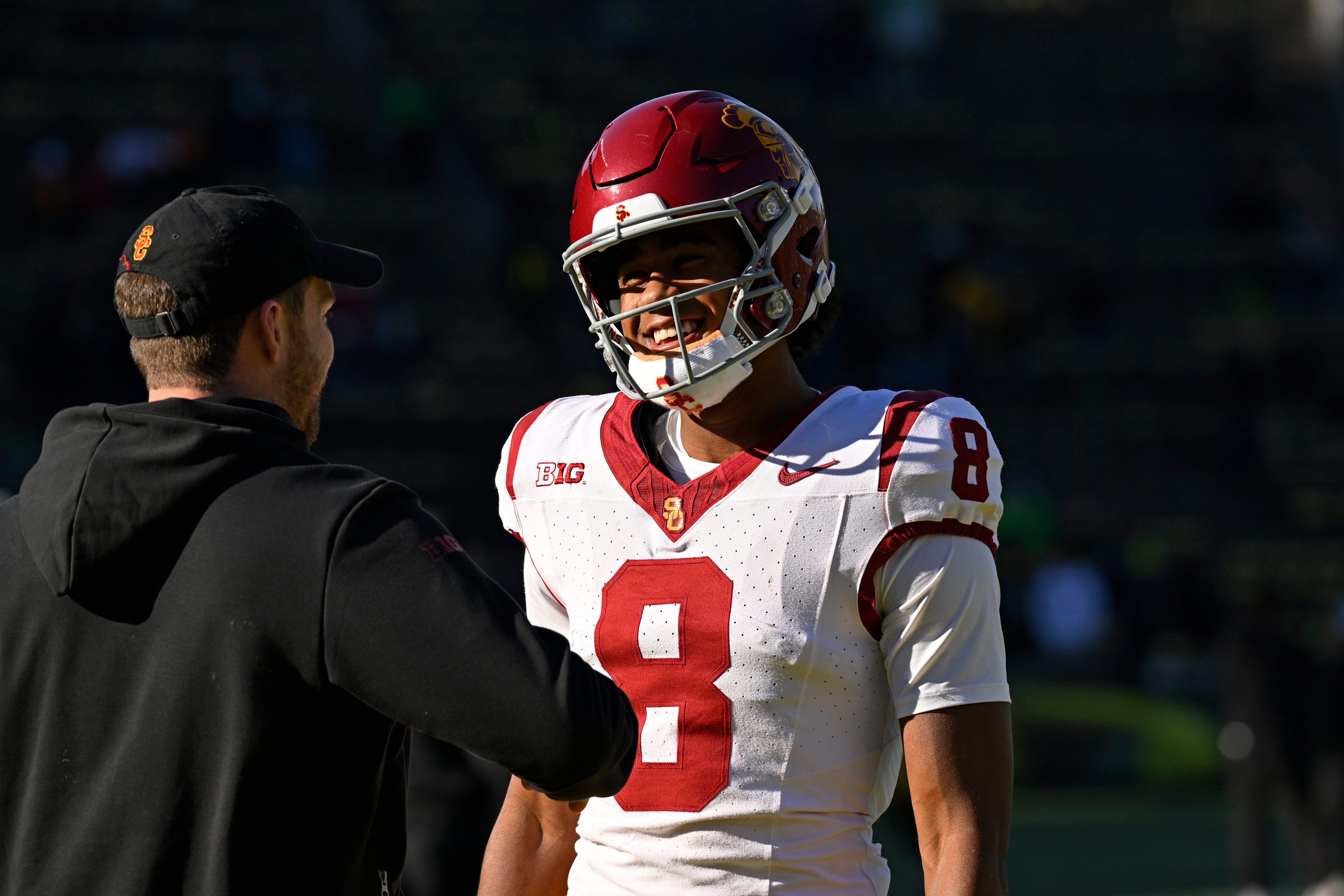 Nov 22, 2025; Eugene, Oregon, USA; Southern California Trojans wide receiver Ja'Kobi Lane (8) talks to a coach before the game against the Oregon Ducks at Autzen Stadium.