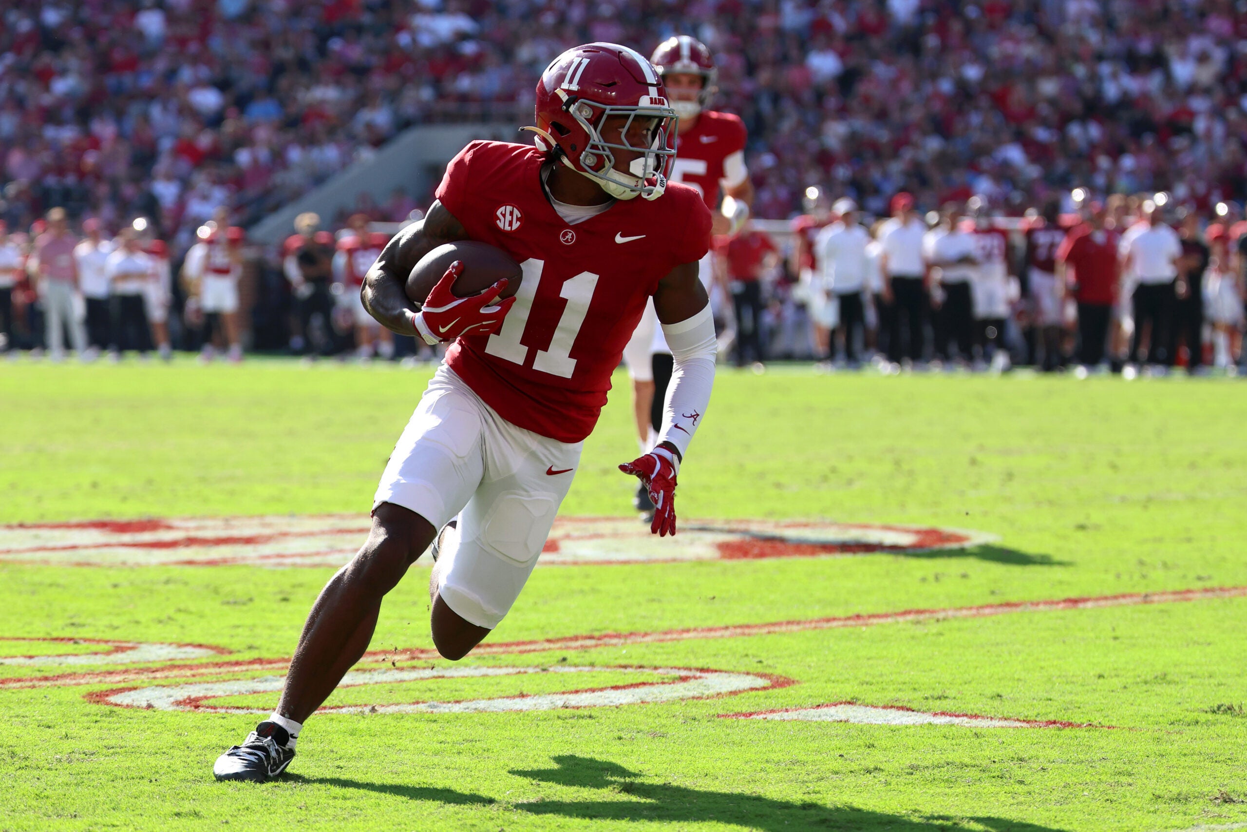 Nov 22, 2025; Tuscaloosa, Alabama, USA; Alabama Crimson Tide wide receiver Rico Scott (11) runs the ball during the first half against the Eastern Illinois Panthers at Saban Field at Bryant-Denny Stadium.
