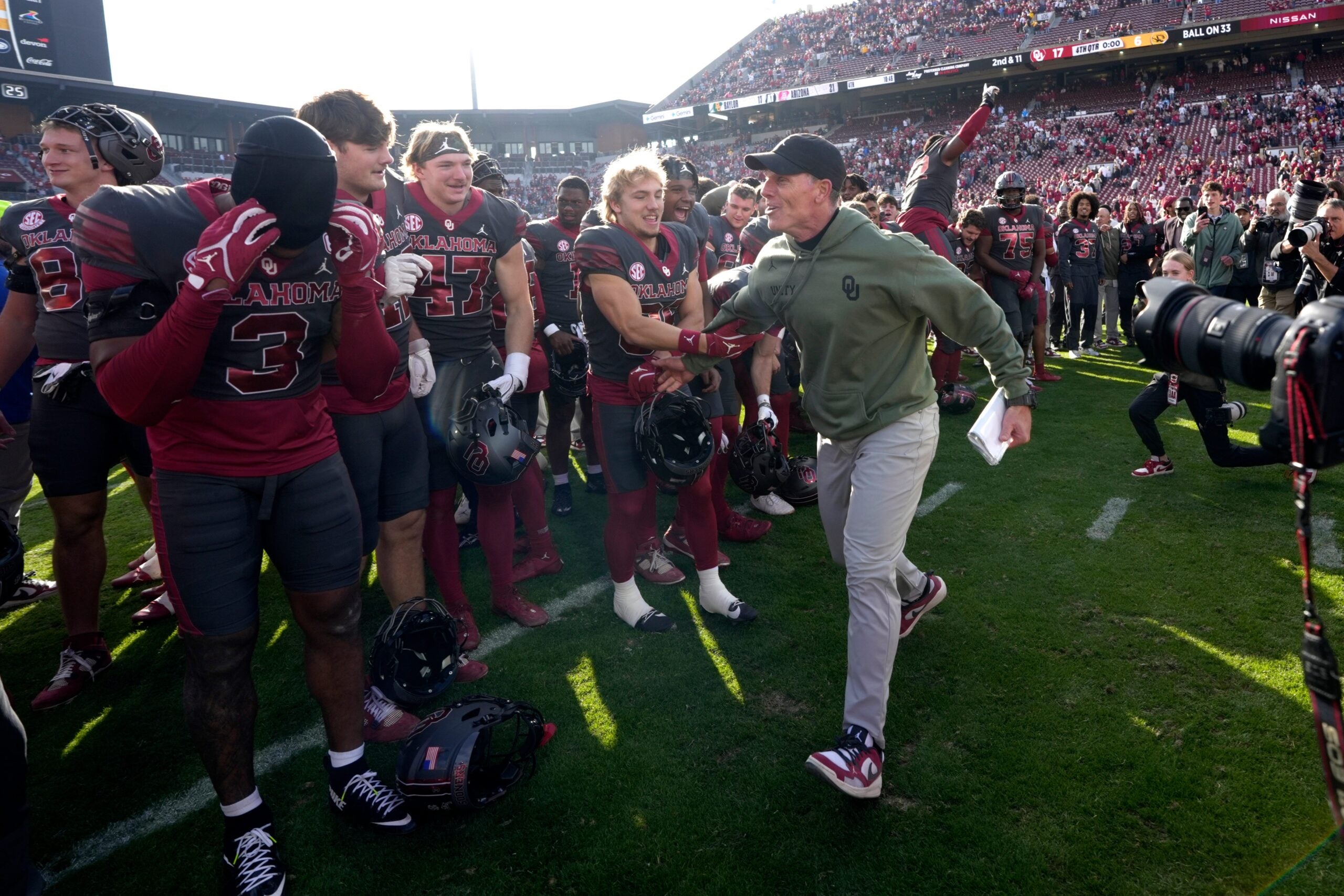 Oklahoma coach Brent Venables celebrates with players after a college football game between the University of Oklahoma Sooners (OU) and the Missouri Tigers at Gaylord Family Ð Oklahoma Memorial Stadium in Norman, Okla., on Saturday, Nov. 22, 2025. Oklahoma won 17-6.