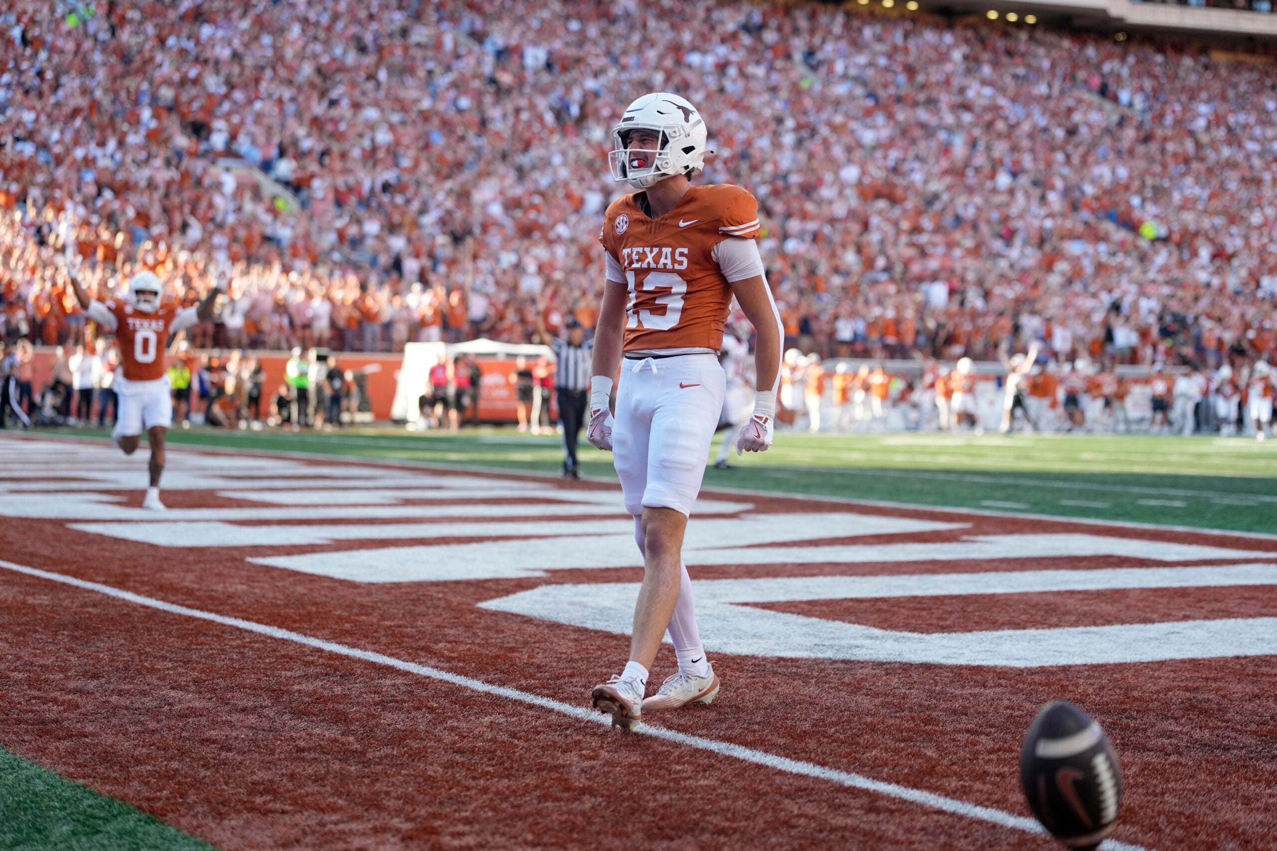 Nov 22, 2025; Austin, Texas, USA; Texas Longhorns wide receiver Parker Livingstone (13) reacts after scoring a touchdown during the first half against the Arkansas Razorbacks at Darrell K Royal-Texas Memorial Stadium.