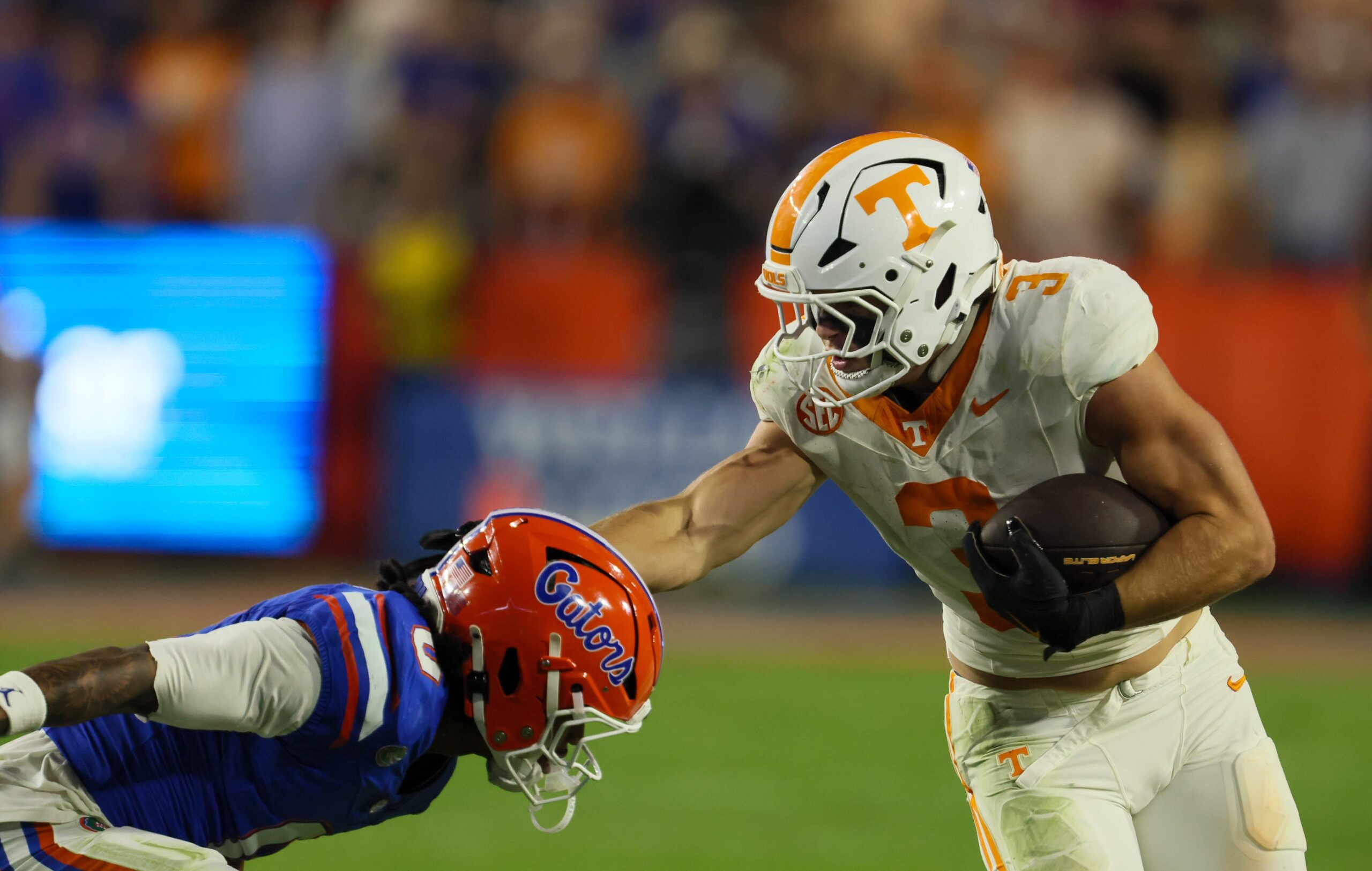 Tennessee tight end Jack van Dorselaer (3) pushes off Florida defensive back Sharif Denson (0) during the second half of an NCAA football game against Tennessee at Steve Spurrier Field at Ben Hill Griffin Stadium in Gainesville, FL on Saturday, November 22, 2025. Florida lost to Tennessee 31-11