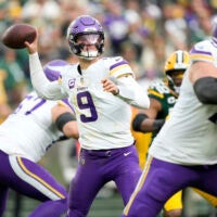 Nov 23, 2025; Green Bay, Wisconsin, USA; Minnesota Vikings quarterback J.J. McCarthy (9) throws the ball against the Green Bay Packers during the second half at Lambeau Field.