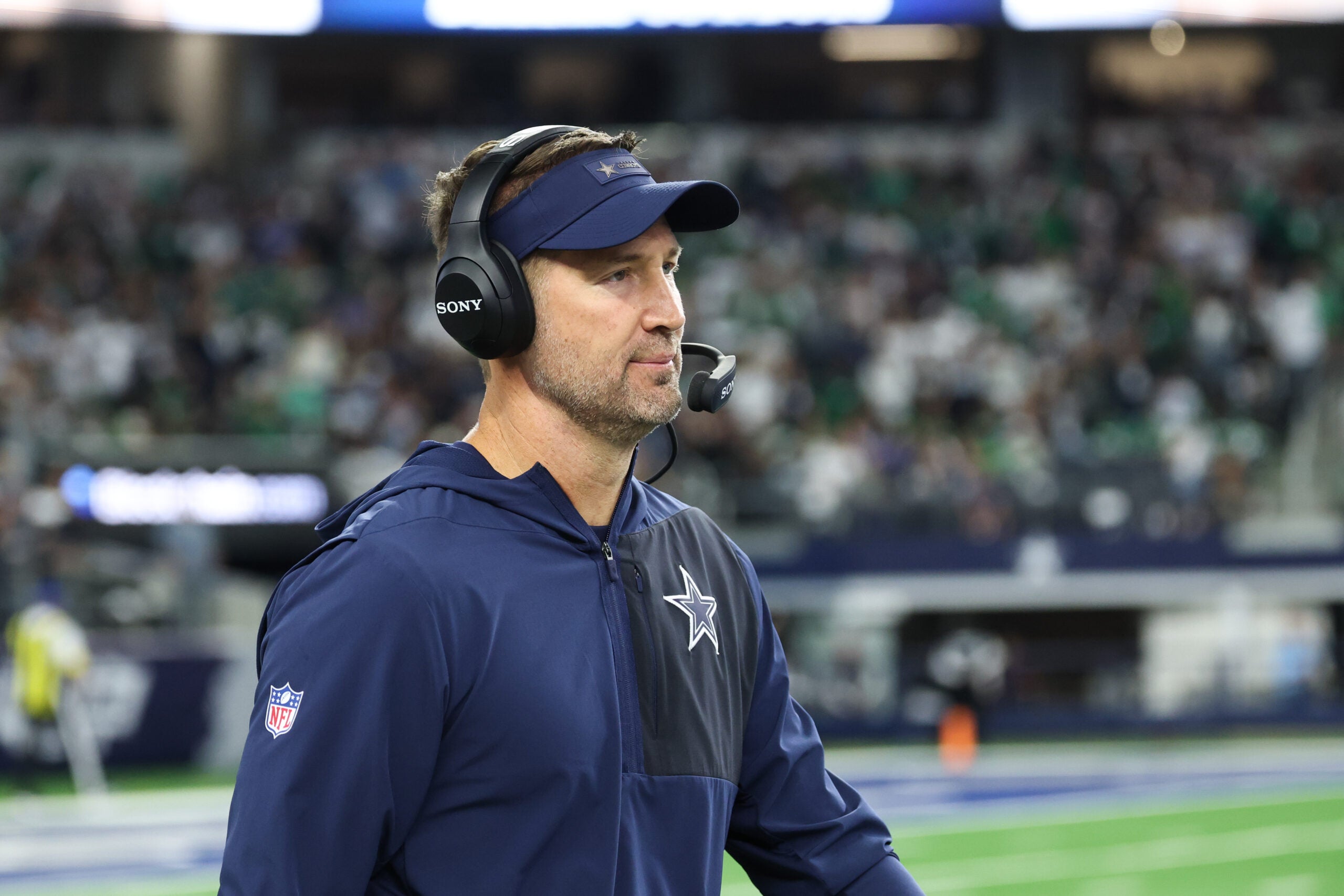 Nov 23, 2025; Arlington, Texas, USA; Dallas Cowboys head coach Brian Schottenheimer looks on before the game against the Philadelphia Eagles at AT&T Stadium.