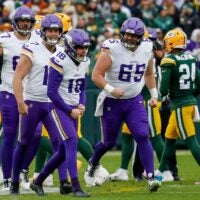 Minnesota Vikings place kicker Will Reichard (16) celebrates after making a field goal to end the first half of a game against the Green Bay Packers on Sunday, November 23, 2025, at Lambeau Field in Green Bay, Wis.