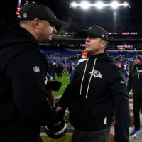 Nov 27, 2025; Baltimore, Maryland, USA; Baltimore Ravens head coach John Harbaugh shakes hands with Cincinnati Bengals head coach Zac Taylor after the game at M&T Bank Stadium.