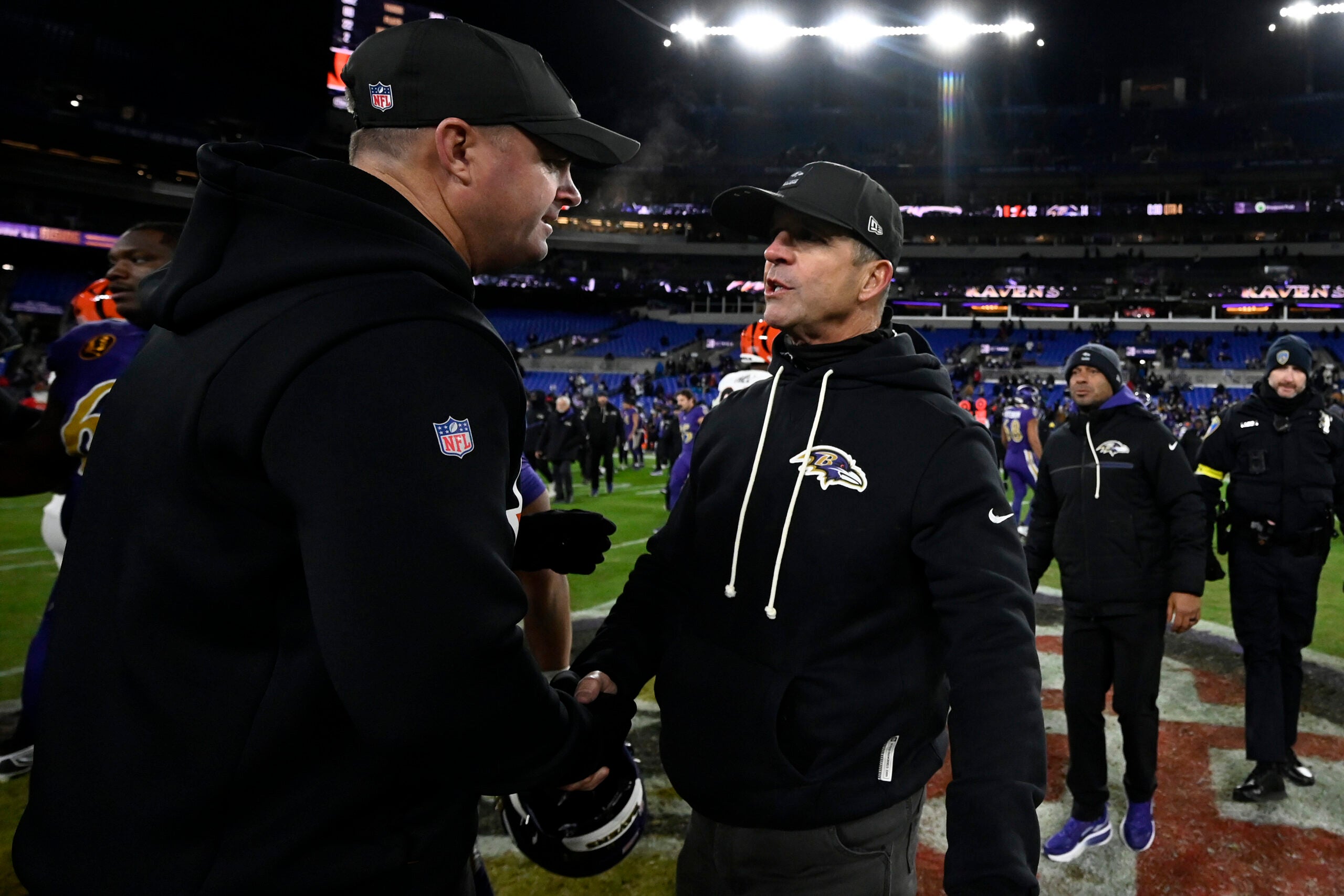 Nov 27, 2025; Baltimore, Maryland, USA; Baltimore Ravens head coach John Harbaugh shakes hands with Cincinnati Bengals head coach Zac Taylor after the game at M&T Bank Stadium.