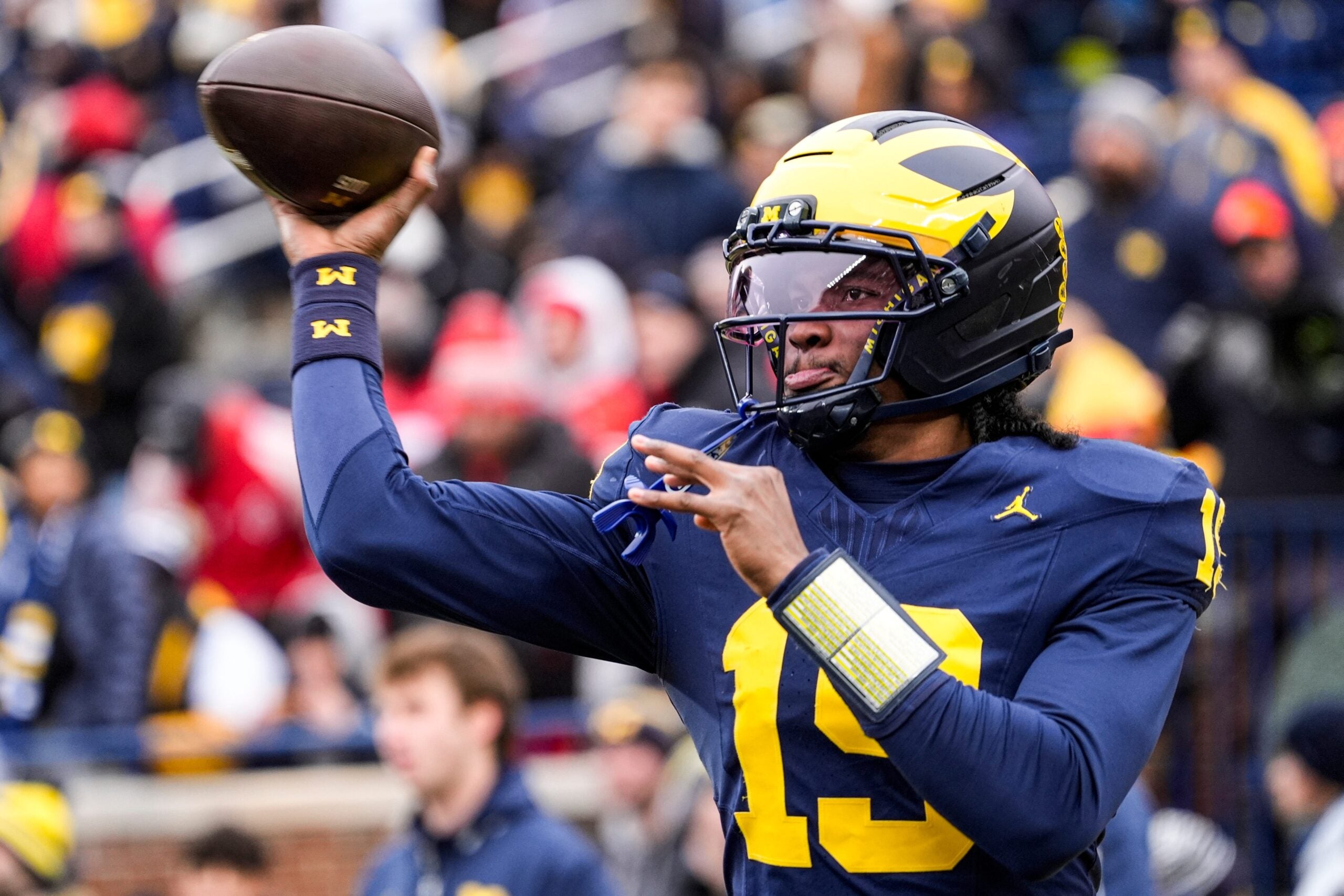 Michigan quarterback Bryce Underwood (19) warms up at Michigan Stadium in Ann Arbor on Saturday, Nov. 29, 2025.