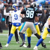 Nov 30, 2025; Charlotte, North Carolina, USA; Los Angeles Rams quarterback Matthew Stafford (9) throws a pass during the first quarter against the Carolina Panthers at Bank of America Stadium.