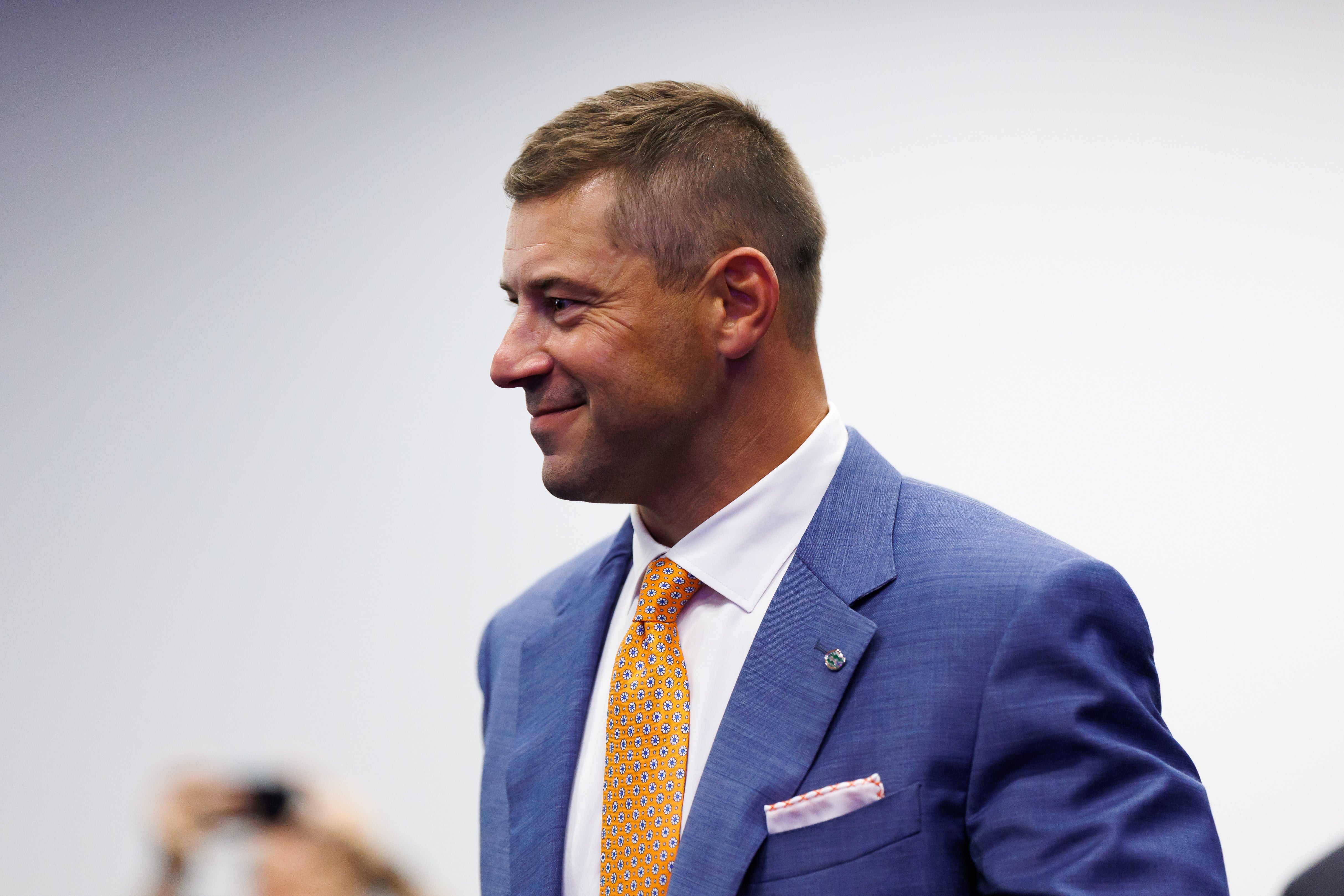 Dec 1, 2025; Gainesville, FL, USA; Florida Gators head coach Jon Sumrall walks into the room before the press conference at the Heavener Football Training Center at the University of Florida.