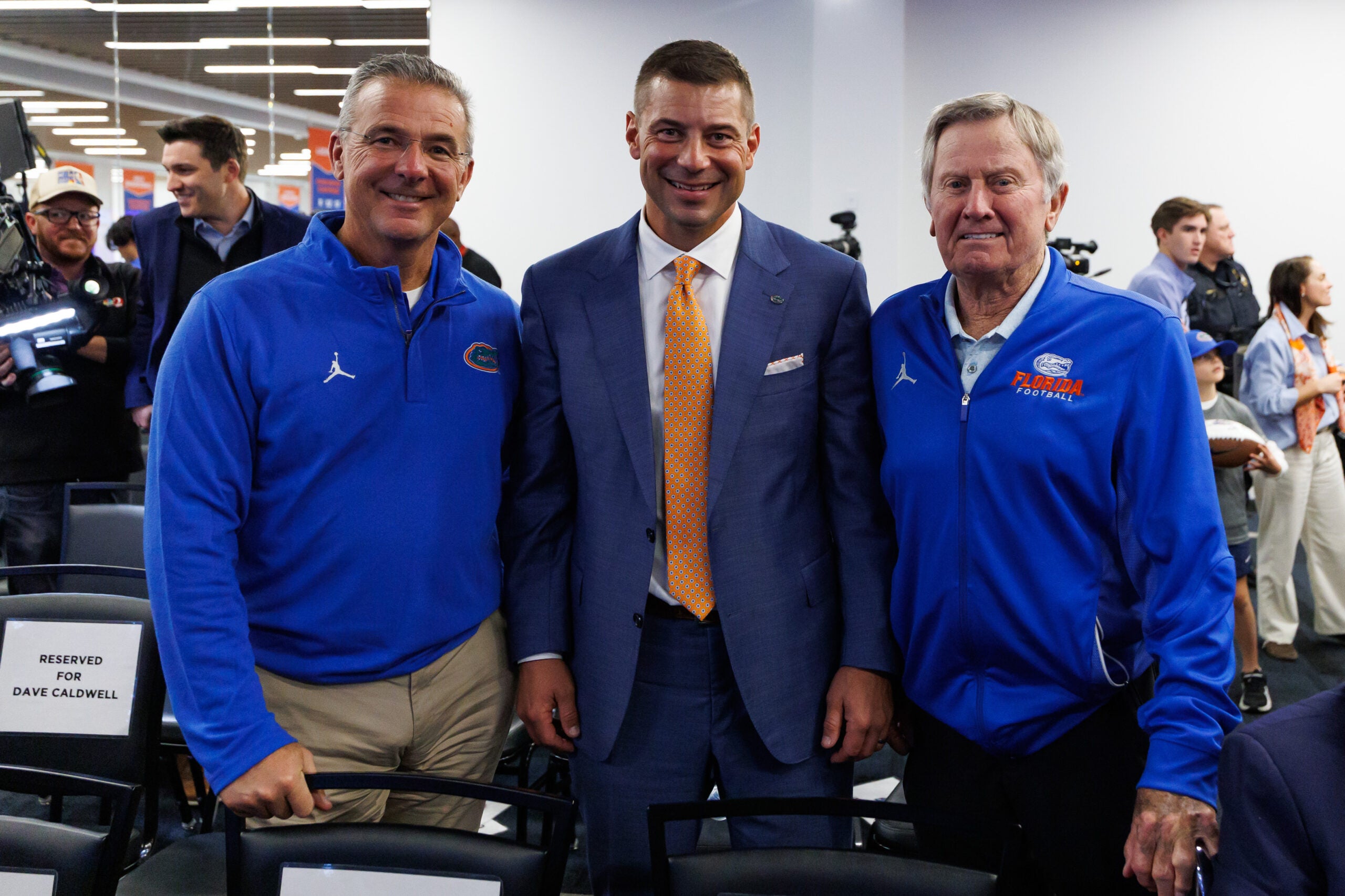 Dec 1, 2025; Gainesville, FL, USA; Florida Gators former head coach Urban Meyer, Florida Gators head coach Jon Sumrall, and Florida Gators former head coach Steve Spurrier pose after the press conference at the Heavener Football Training Center at the University of Florida.