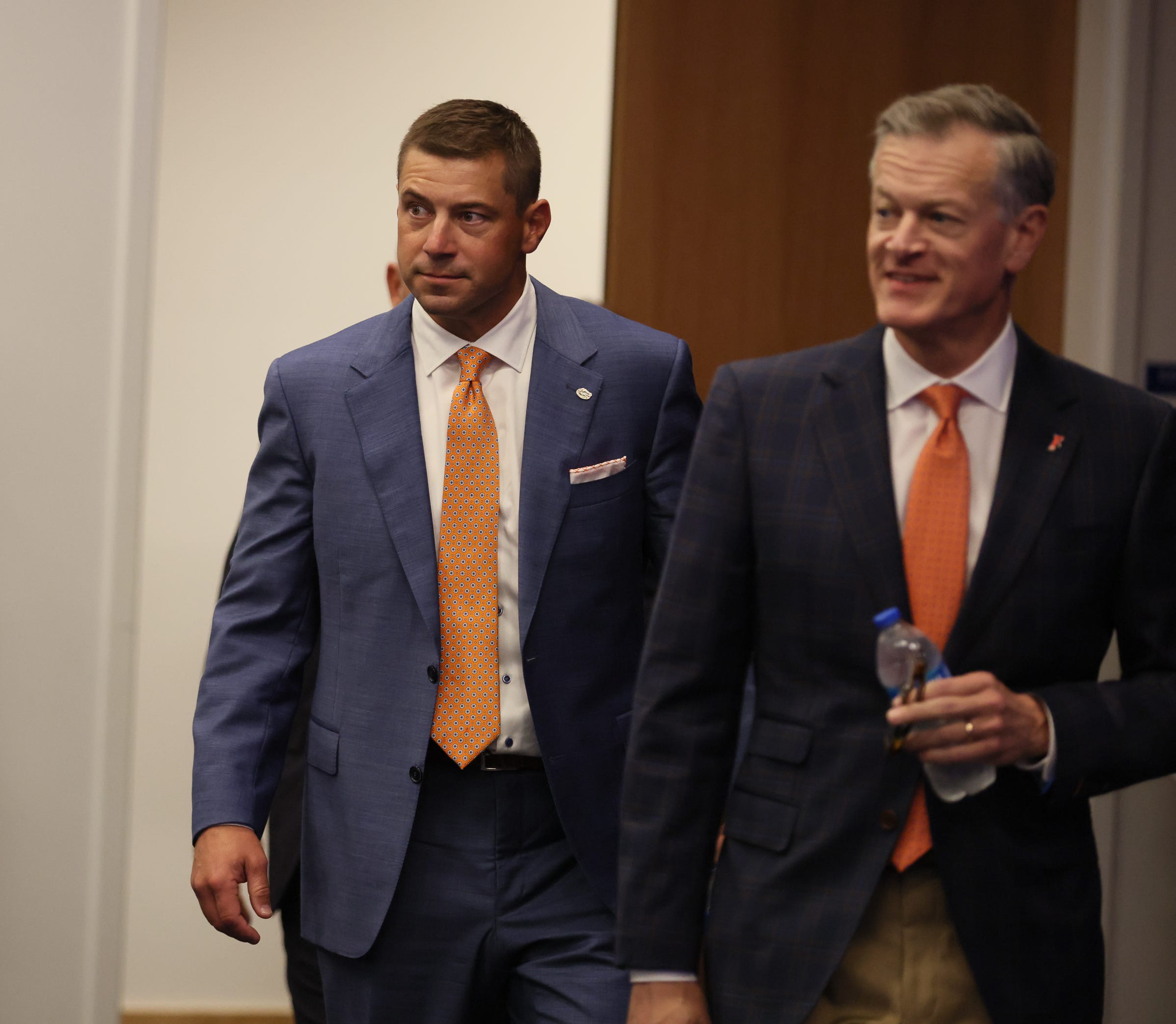 New UF head football coach Jon Sumrall, left, and UF Athletic Director Scott Stricklin arrives at the James W. “Bill” Heavener Football Training Center in Gainesville, FL on Monday, December 1, 2025.