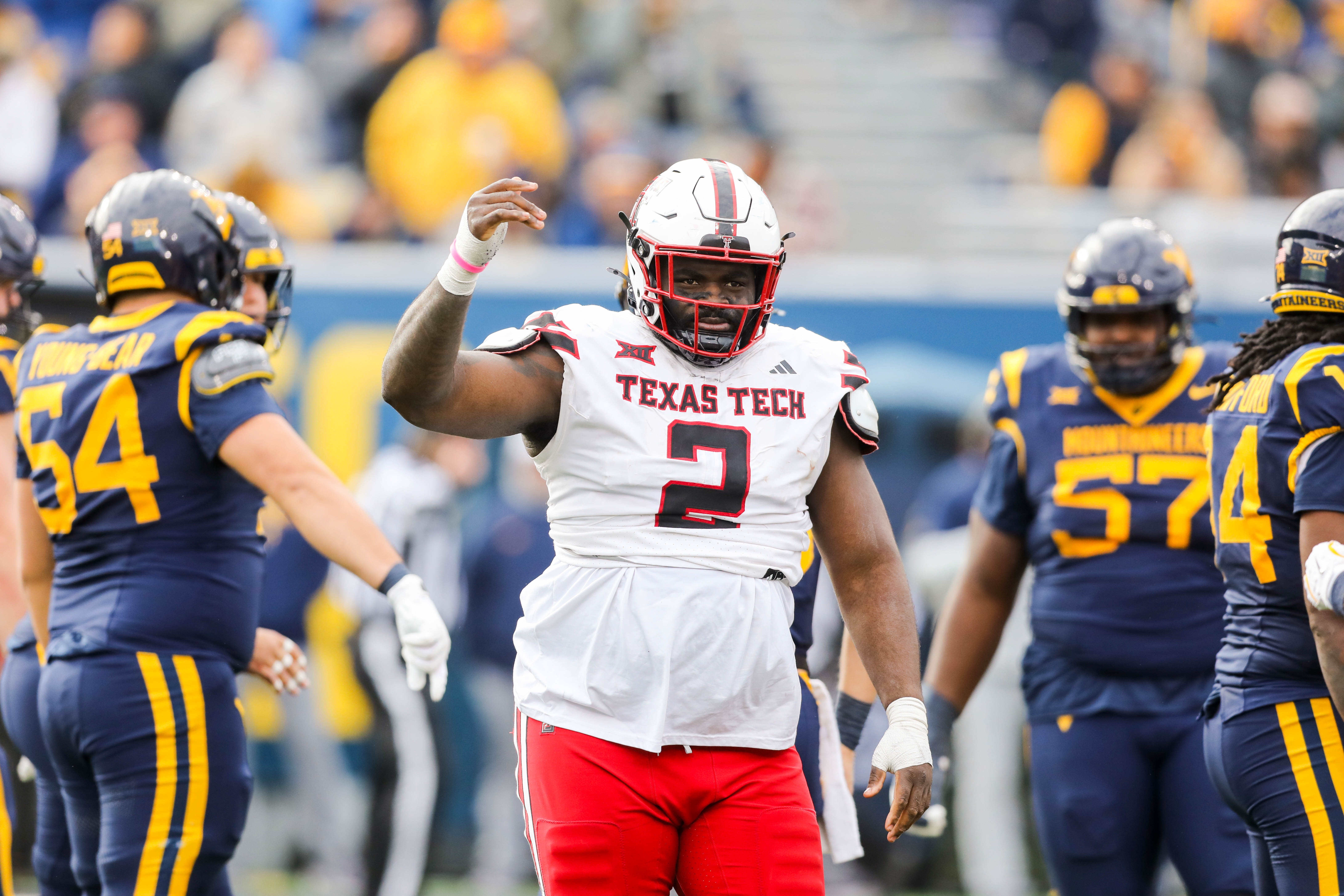 Nov 29, 2025; Morgantown, West Virginia, USA; Texas Tech Red Raiders defensive tackle Lee Hunter (2) signals to the sideline during the second quarter against the West Virginia Mountaineers at Milan Puskar Stadium.