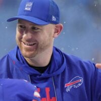 Buffalo Bills offensive coordinator Joe Brady greets players as they take the field before their game against the Bengals at Highmark Stadium in Orchard Park on Dec. 7, 2025.