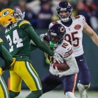 Chicago Bears wide receiver Luther Burden III (10) stiff-arms Green Bay Packers cornerback Carrington Valentine (24) on Sunday, December 7, 2025, at Lambeau Field in Green Bay, Wis.