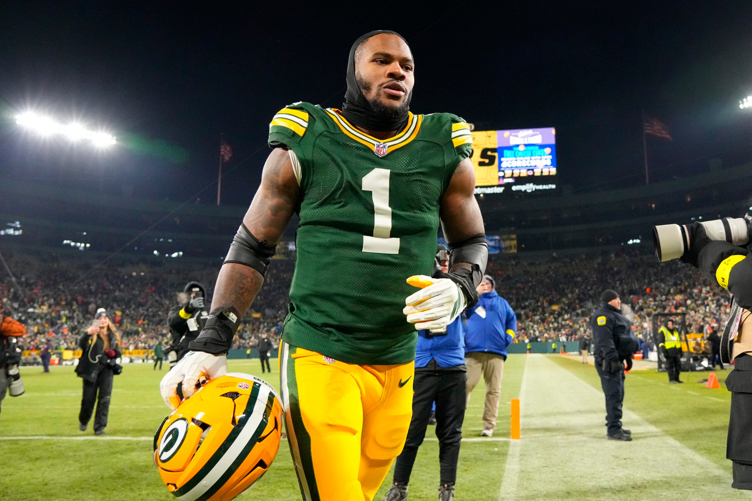 Dec 7, 2025; Green Bay, Wisconsin, USA; Green Bay Packers defensive end Micah Parsons (1) jogs off the field following the game against the Chicago Bears at Lambeau Field.