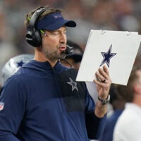 Dec 14, 2025; Arlington, Texas, USA; Dallas Cowboys head coach Brian Schottenheimer during the first half against the Minnesota Vikings at AT&T Stadium.