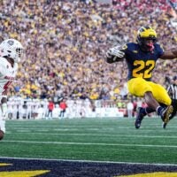 Michigan running back Justice Haynes (22) leaps into the end zone for a touchdown against New Mexico during the first half at Michigan Stadium in Ann Arbor on Saturday, August 30, 2025.