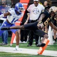 Vanderbilt wide receiver Tre Richardson (6) leaps for a touchdown past Kentucky defensive back Ty Bryant (14) during the second quarter at FirstBank Stadium in Nashville, Tenn., Saturday, Nov. 22, 2025.