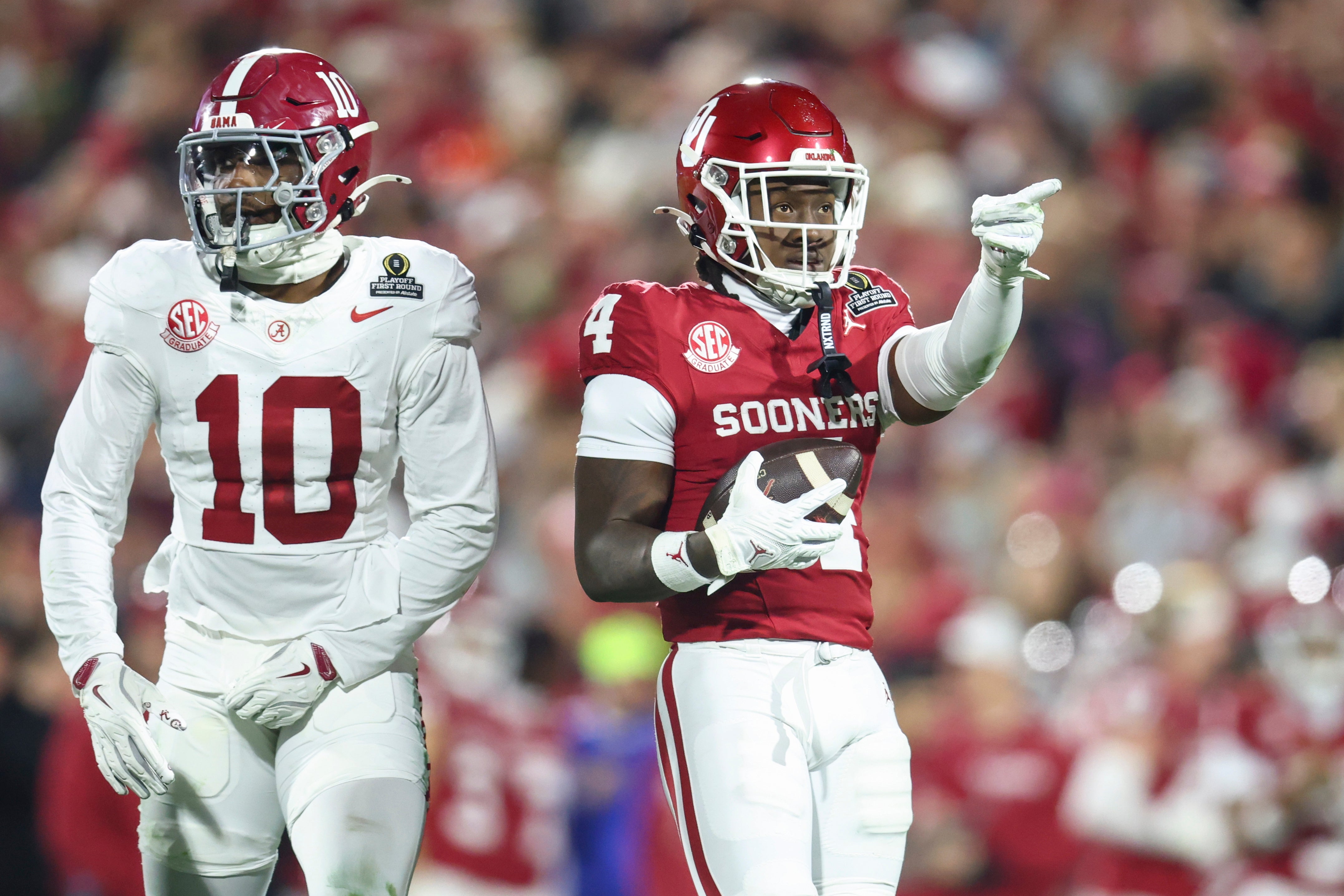Dec 19, 2025; Norman, OK, USA; Oklahoma Sooners wide receiver Deion Burks (4) gestures in the first half against the Alabama Crimson Tide at Gaylord Family OK Memorial Stadium.