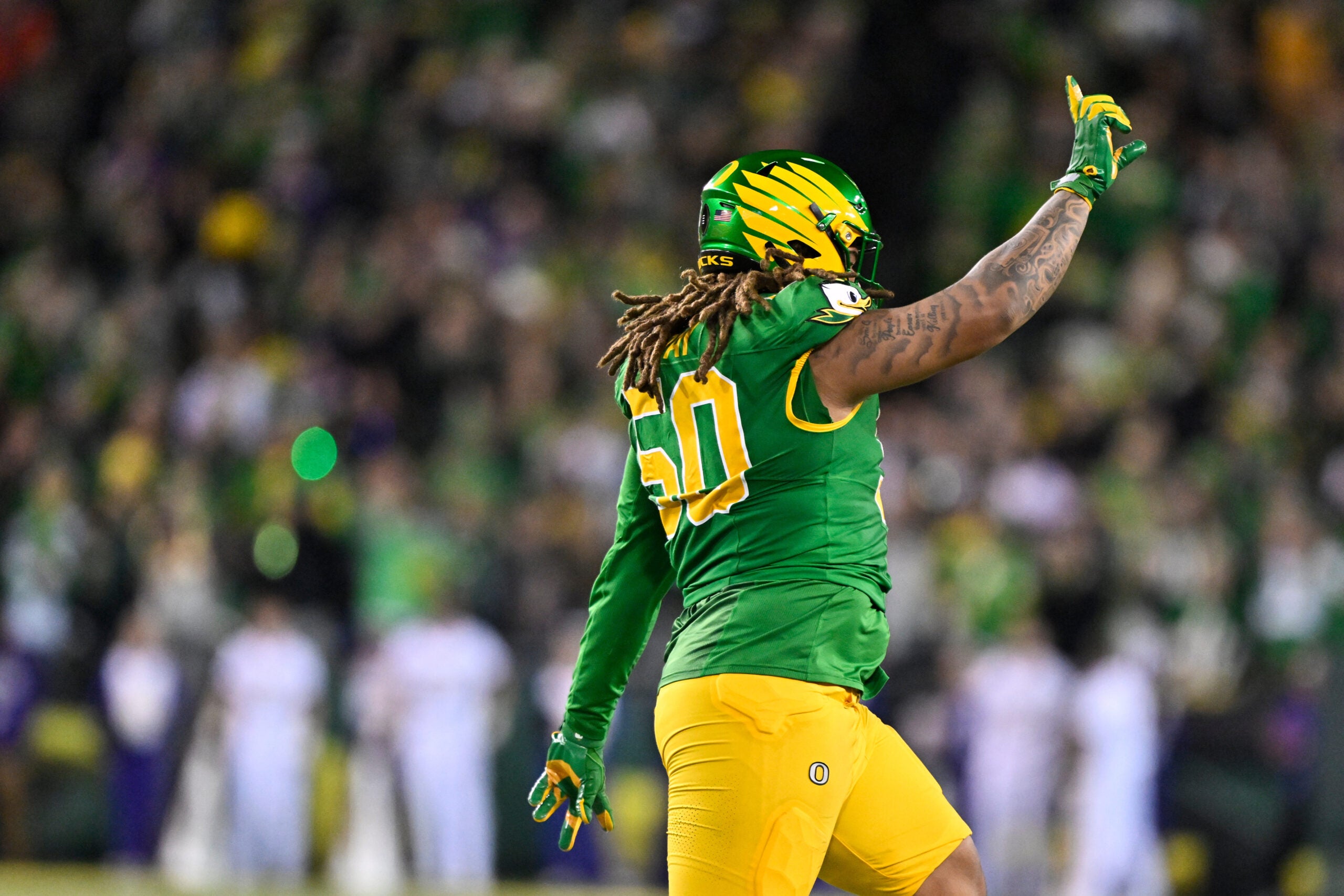 Dec 20, 2025; Eugene, OR, USA; Oregon Ducks defensive lineman Tionne Gray (50) celebrates a blocked field goal during the second quarter against the James Madison Dukes at Autzen Stadium. Mandatory Credit: Craig Strobeck-Imagn Images