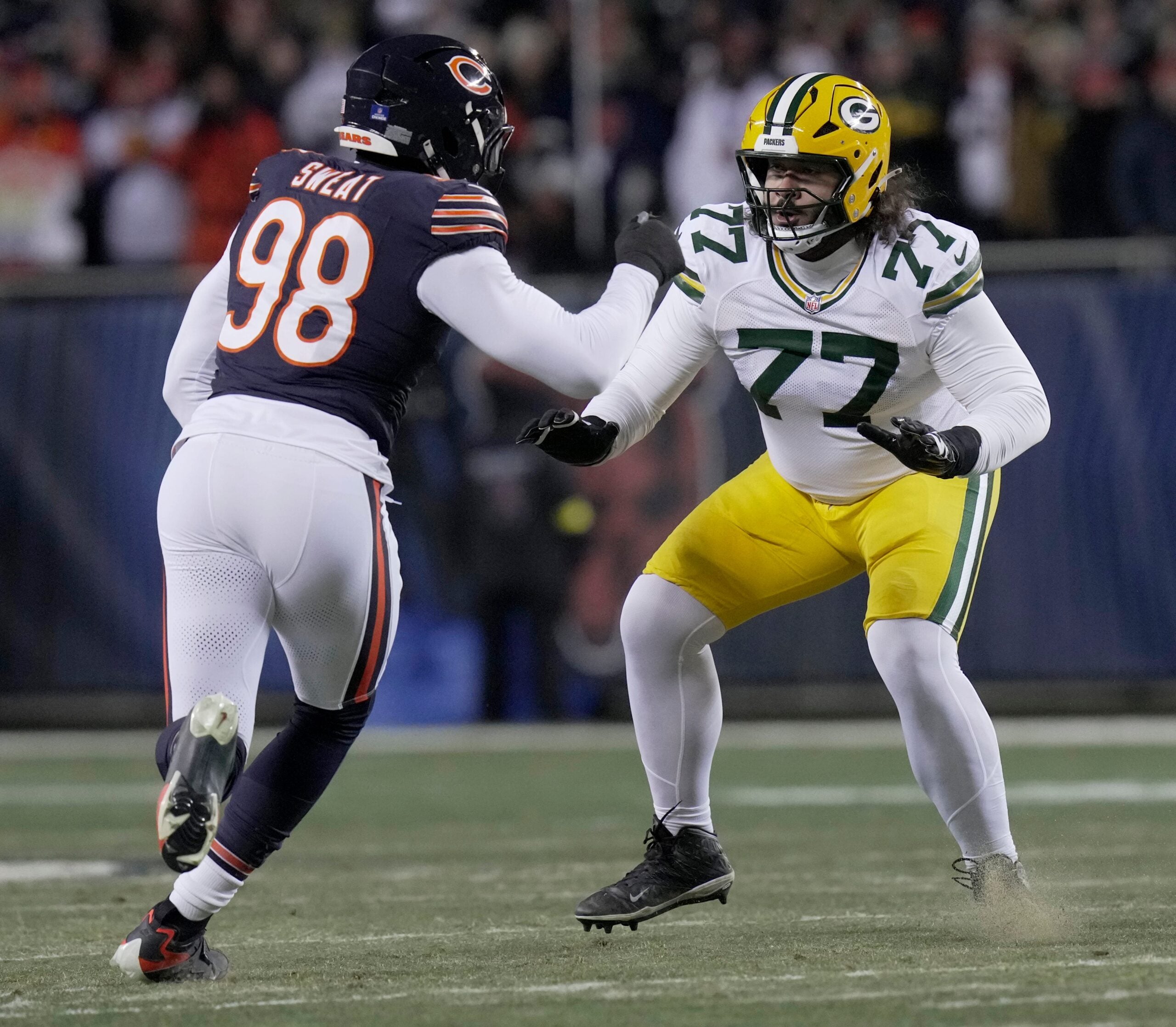 Green Bay Packers guard Jordan Morgan (77) blocks Chicago Bears defensive end Montez Sweat (98) during the second quarter of their game Saturday, December 20, 2025 at Soldier Field in Chicago, Illinois.