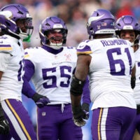 Dec 21, 2025; East Rutherford, New Jersey, USA; Minnesota Vikings defensive lineman Jalen Redmond (61) reacts with linebacker Eric Wilson (55) during the first half at MetLife Stadium.