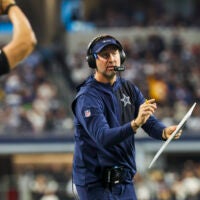 Dec 21, 2025; Arlington, Texas, USA; Dallas Cowboys head coach Brian Schottenheimer reacts to a play against the Los Angeles Chargers during the second quarter at AT&T Stadium.