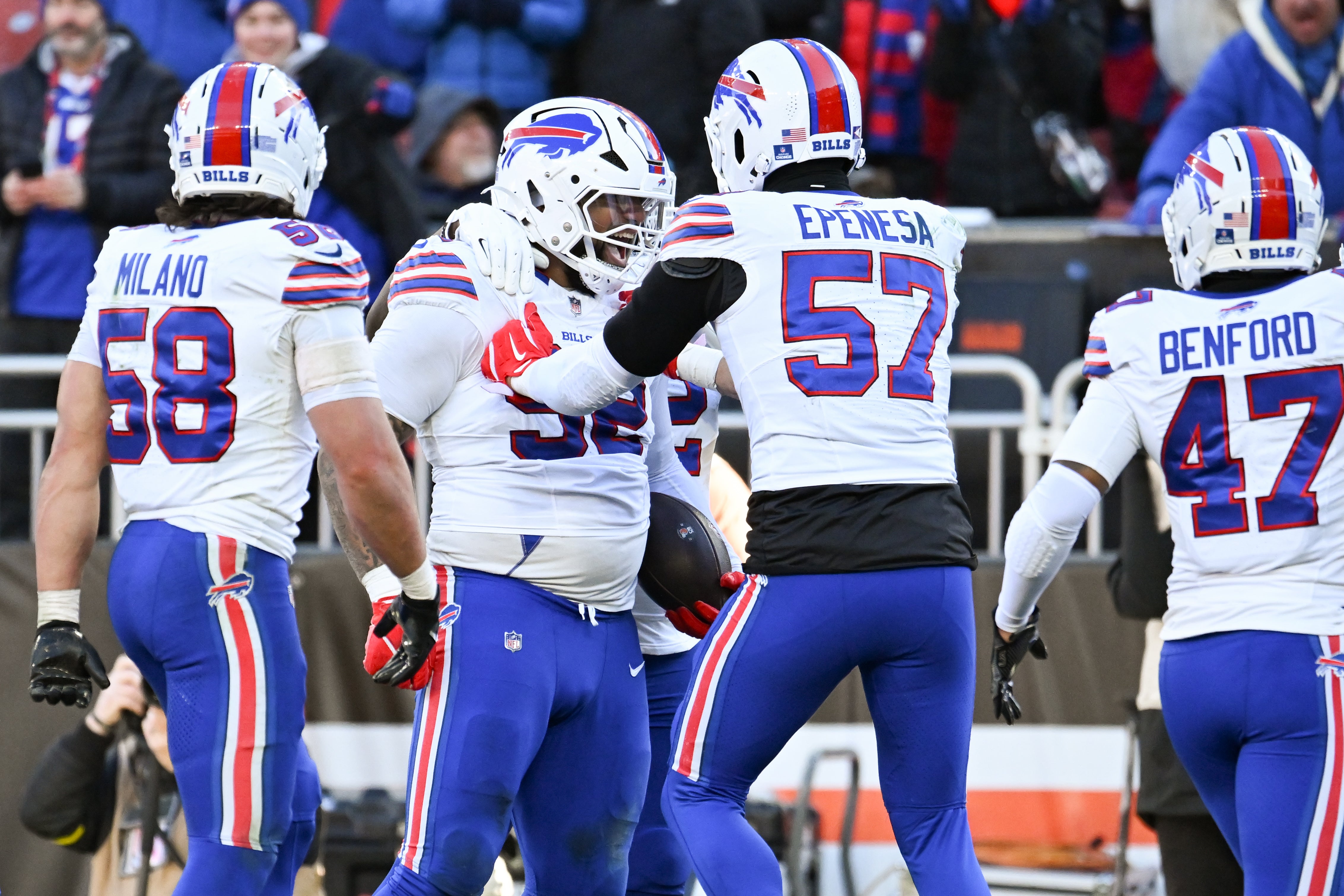 Dec 21, 2025; Cleveland, Ohio, USA; Buffalo Bills defensive tackle Daquan Jones (92) reacts with defensive end AJ Epenesa (57) after an interception against the Cleveland Browns during the second half at Huntington Bank Field.
