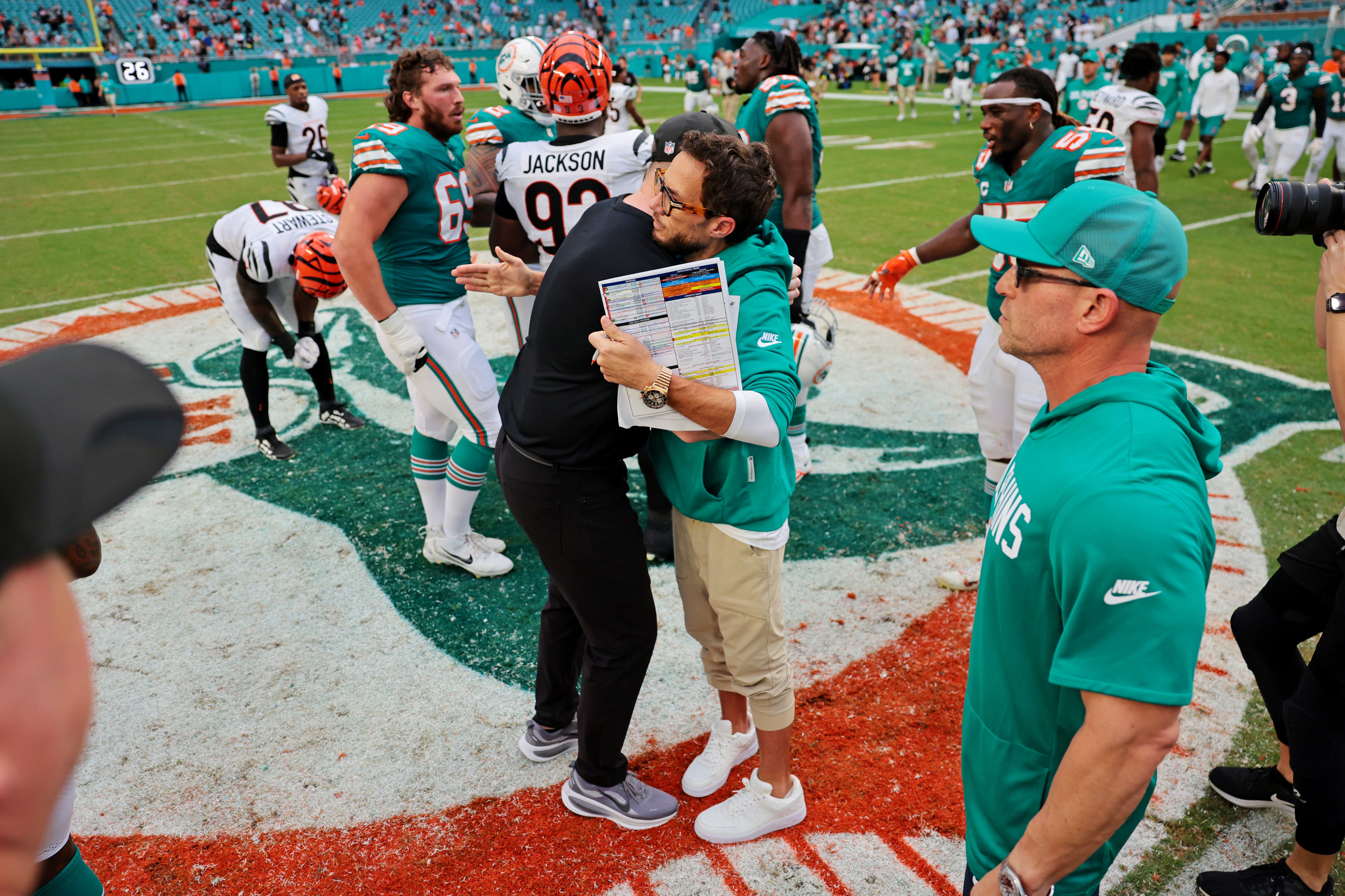 Dec 21, 2025; Miami Gardens, Florida, USA; The Cincinnati Bengals head coach Zac Taylor and the Miami Dolphins head coach Mike McDaniel react after the game at Hard Rock Stadium.